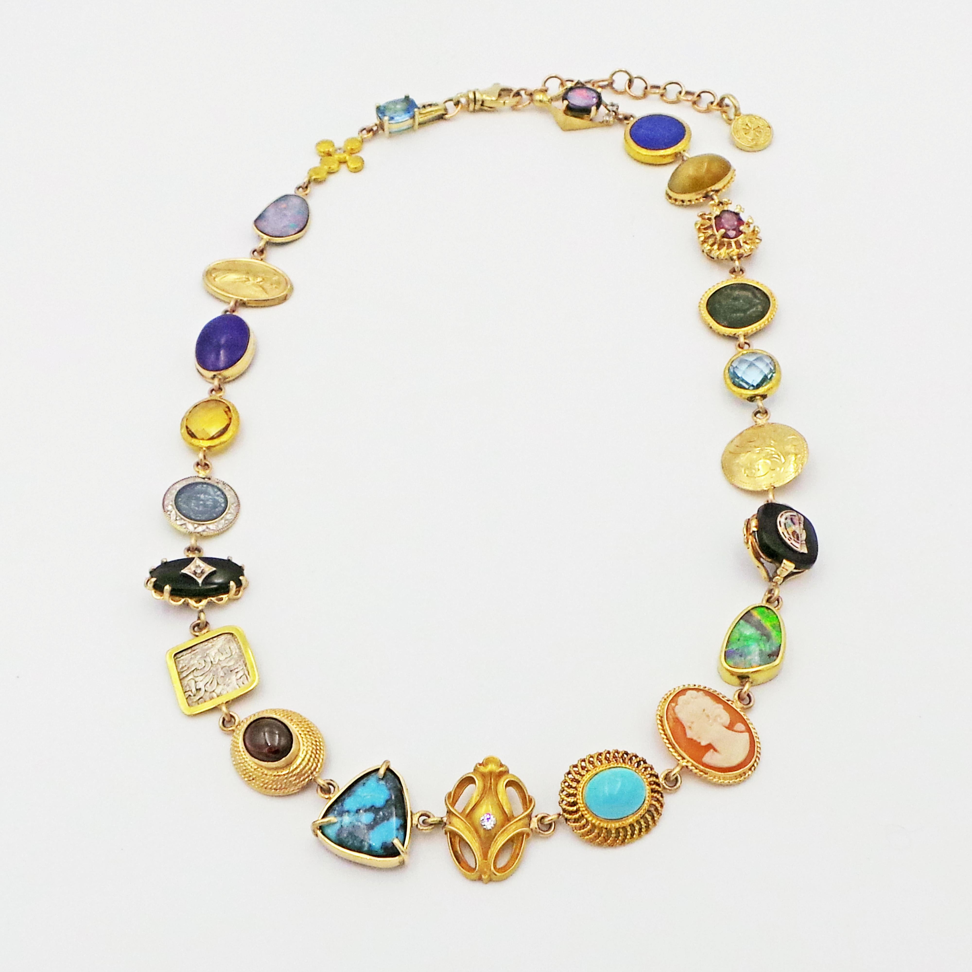 One-of-a-kind, Bohemian necklace features multiple gemstones, vintage jewelry pieces and ancient coins set in 14k yellow gold. Amazing 23 pieces include: blue Topaz, Australian Opal, Diamonds, Lapis Lazuli, Citrine, Onyx, Garnet, Turquoise, Cat's