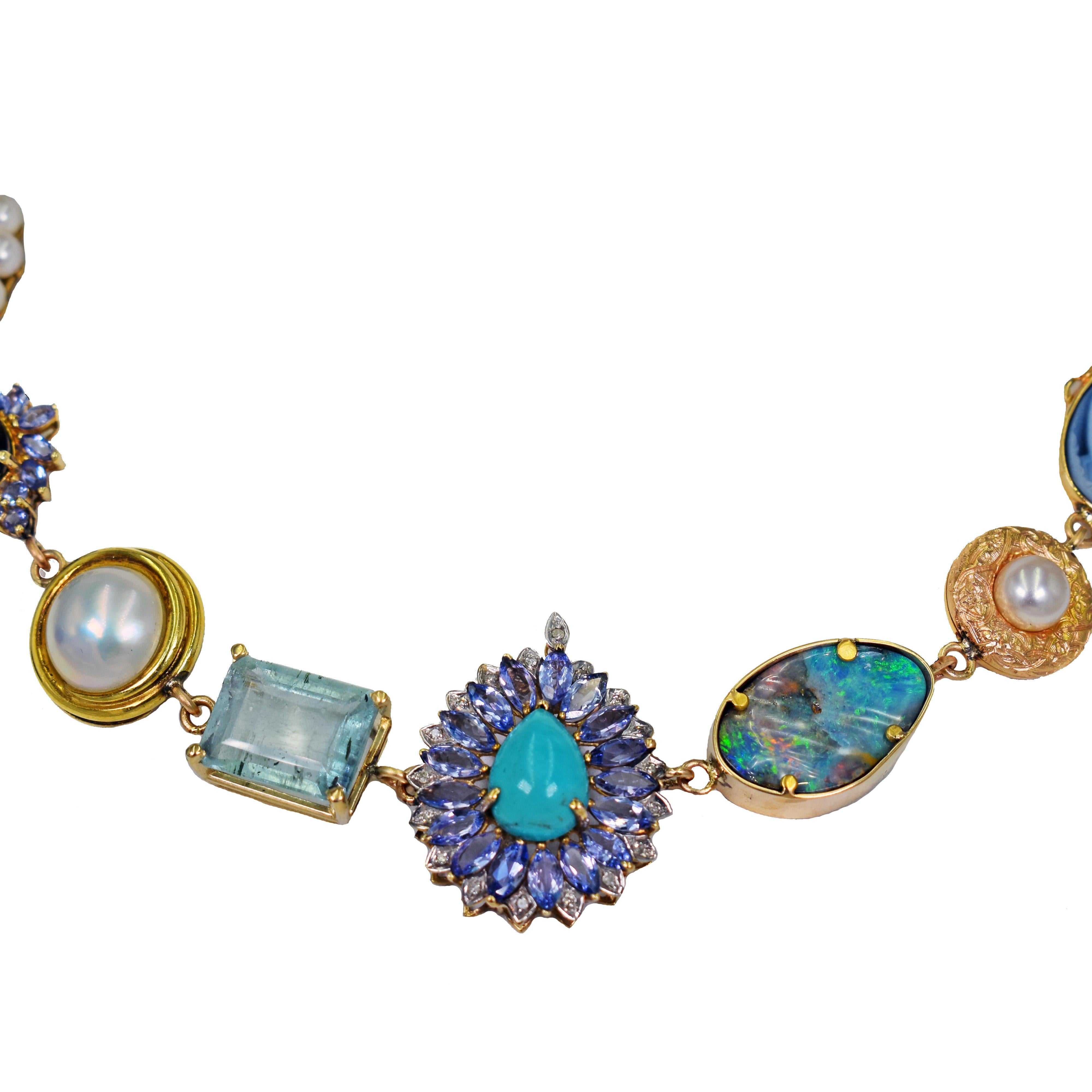 One-of-a-kind Vicki Orr 14k yellow gold Bohemian necklace with a variety of gemstones, vintage and antique jewelry components and an antique coin. Necklace has 21 unique pieces, featuring Tanzanite, Australian Boulder Opal, Amethyst, Carico Lake