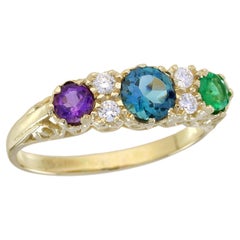 Bague vintage à trois pierres en or jaune massif 9 carats