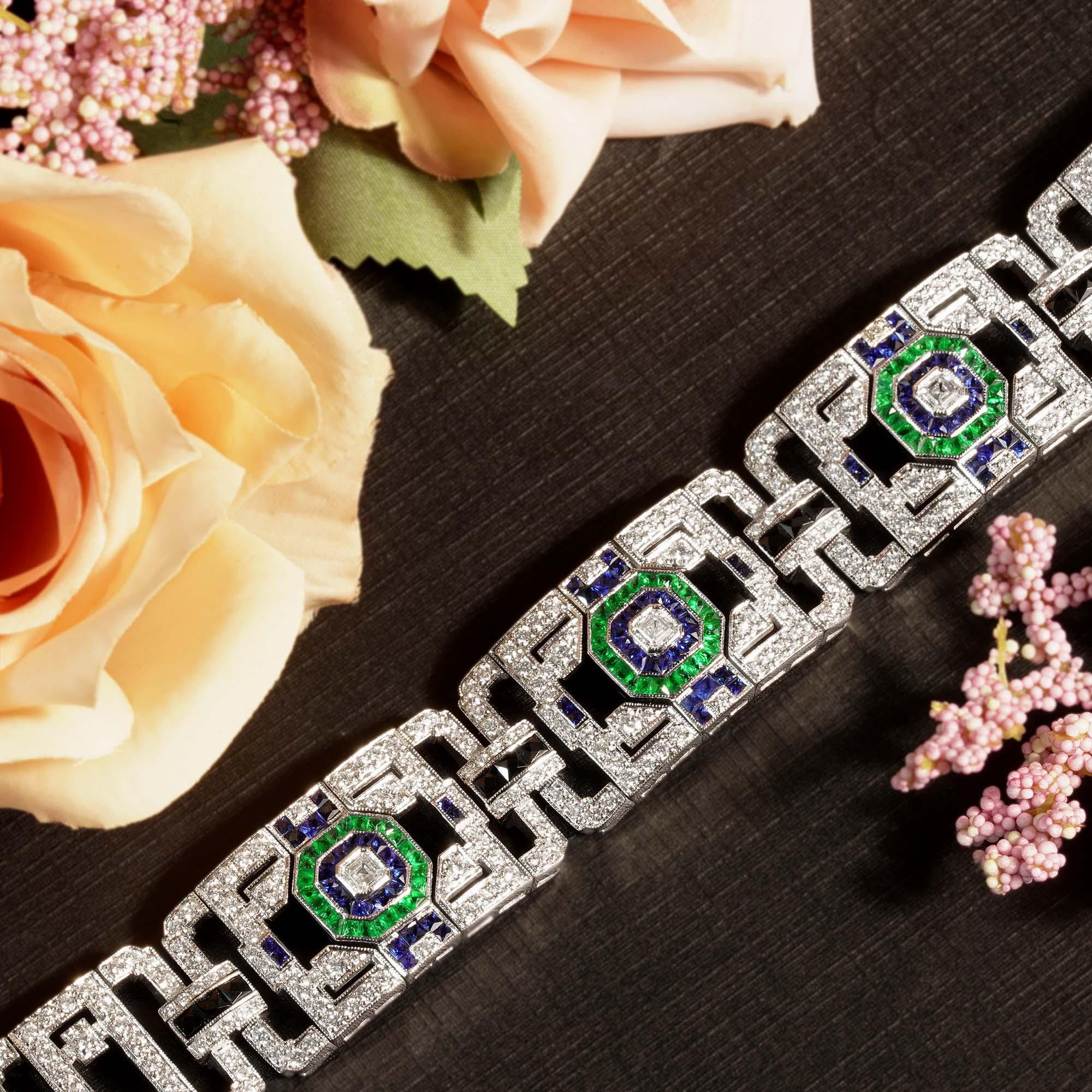 This elegance bracelet reverting “jazz age”. The feel of white gold and the sparkle from the diamonds and gemstones all come together perfectly in this magnificent details. The bracelet features four open geometric panels set with Asscher cut