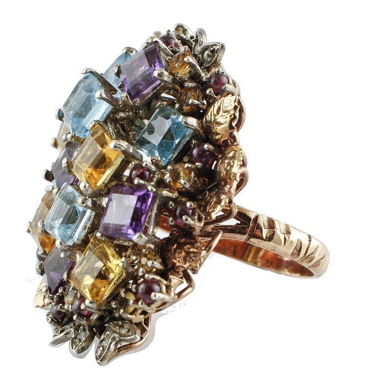 Shiny fashion ring, mounted in 9Kt gold and silver , with a cluster of yellow topazes and light blue topazes, amethysts, garnets and diamonds.
Ring Size: ITA 17 - French 57 - US 8 - UK Q
Tot weight 18.4 gr
Diamonds 0.18 Kt
Gemstones 10.00 Kt
Rf.