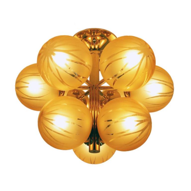 Elegant Sputnik ceiling lamp with nine glass globes on a brass base. Designed by the Swiss artist and designer Max Bill for Temde, Switzerland in the 1960s. 

Design: Max Bill. 
Measures: diameter 17.7