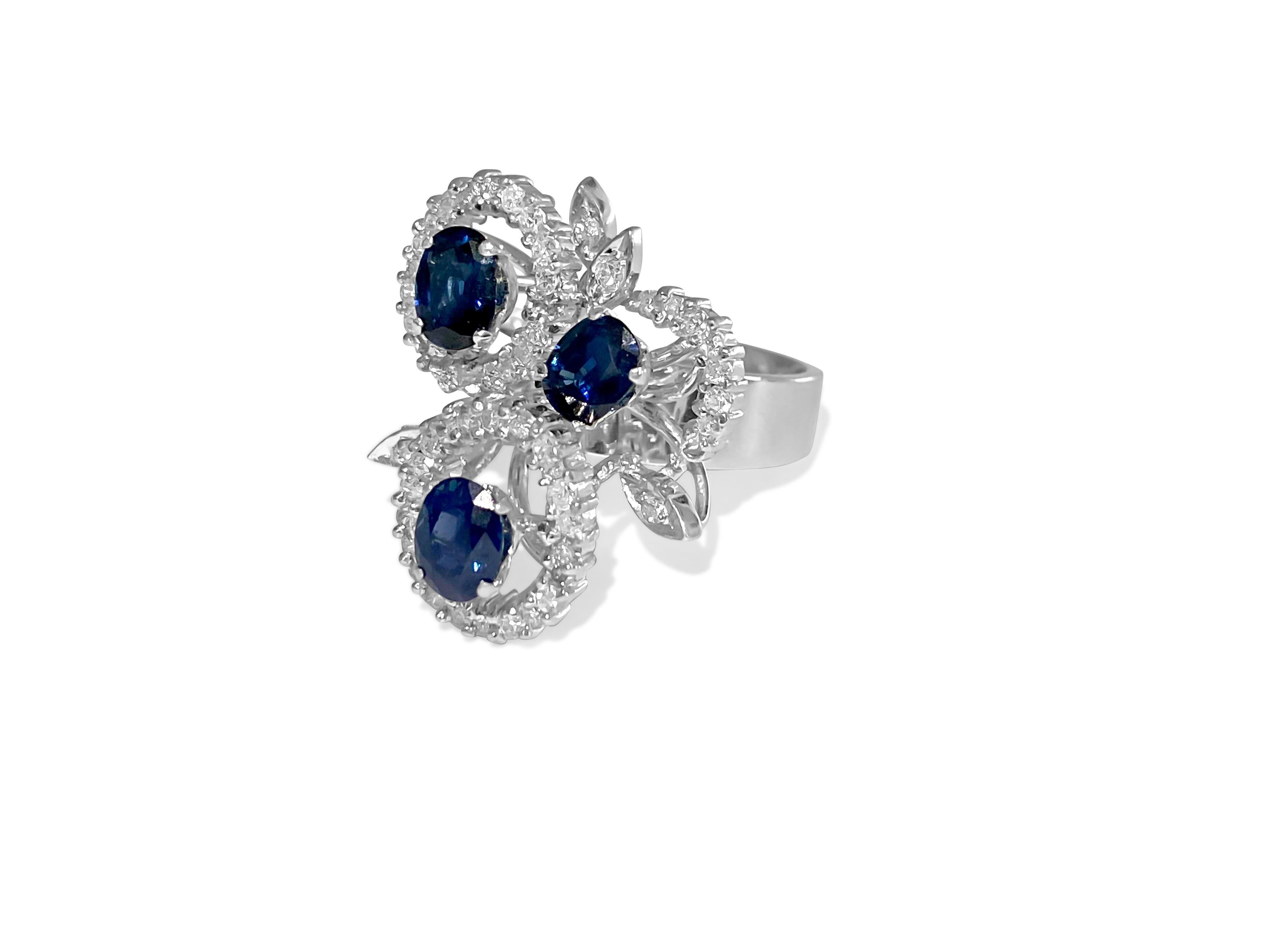 Metal: 18K white gold. 

1.25 carat diamonds total. VS-SI clarity and F-G color. Round brilliant cut diamonds set in prongs. 100% natural earth mined and genuine diamonds. 

Blue Sapphire: 1.25 carat blue sapphire. Oval cut cornblue sapphires. 100%