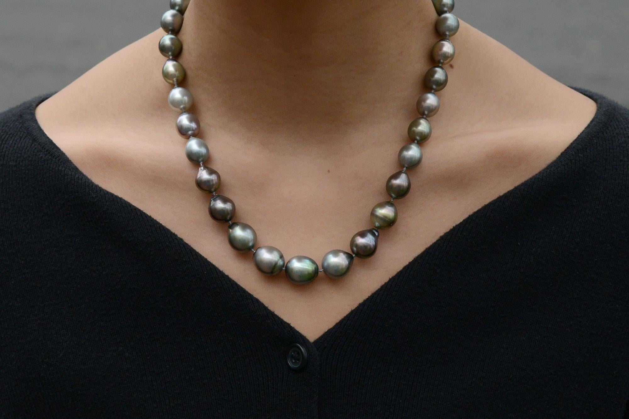 A lovely, lustrous black Tahitian pearl necklace. The graduated strand is composed of 31 baroque and circlè shapes in an ideal 18 1/2