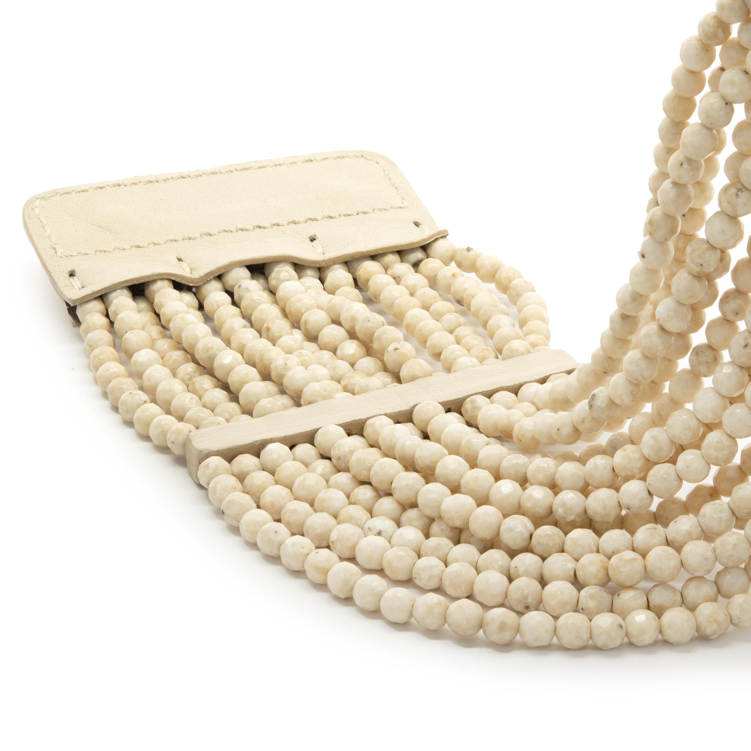 Designer: custom
Material: cream beads
Weight: 161.14 grams
Dimensions: collar measures 16-inches