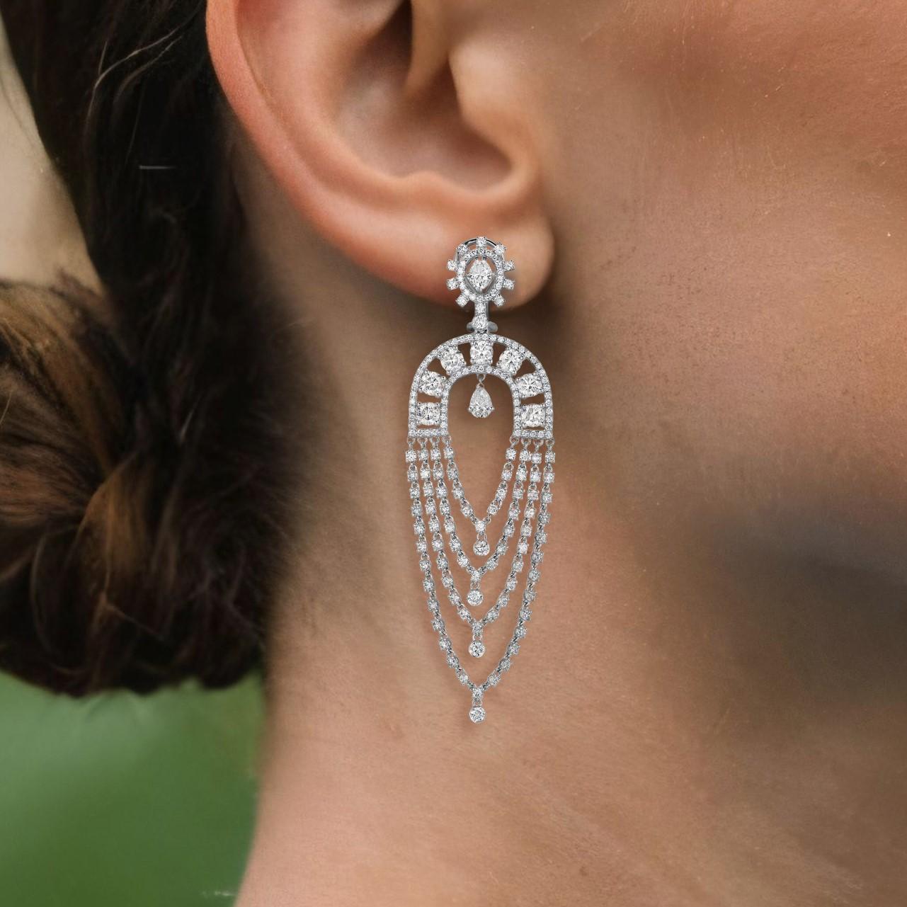 Make a bold statement with the Multi Layered 14K White Gold Chandelier Drop Earrings. Featuring 7.96ct of full-cut diamonds and 1.16ct of stunning fancy diamonds, these earrings create a dazzling wave of brilliance. Their luxurious design adds a