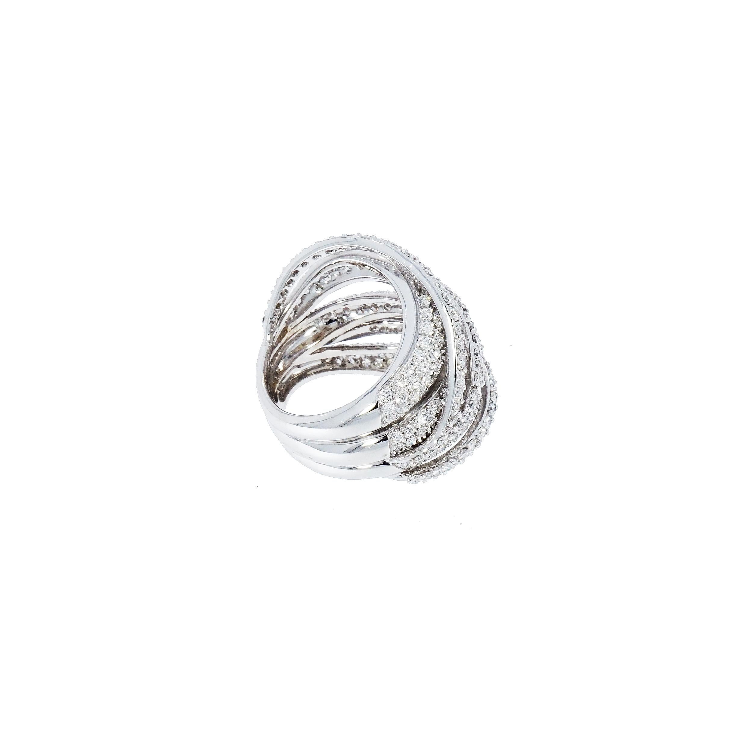 Created with high quality precious diamonds that comes together one by one to enhance beauty in this Multi-layered Diamond Pave White Gold Domed Cocktail Ring.
Inspired by the shapes of nature, in their precious liveries and geometric textures with