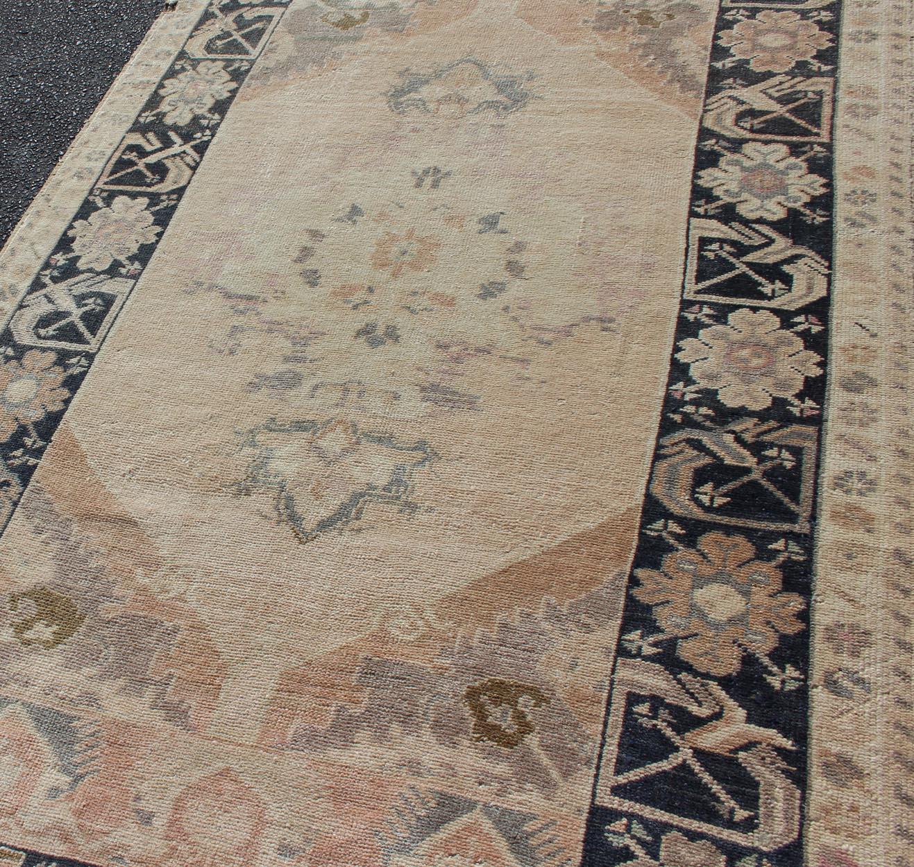 20th Century Multi-Layered Medallion Vintage Turkish Oushak Rug in Cream and Midnight Blue For Sale