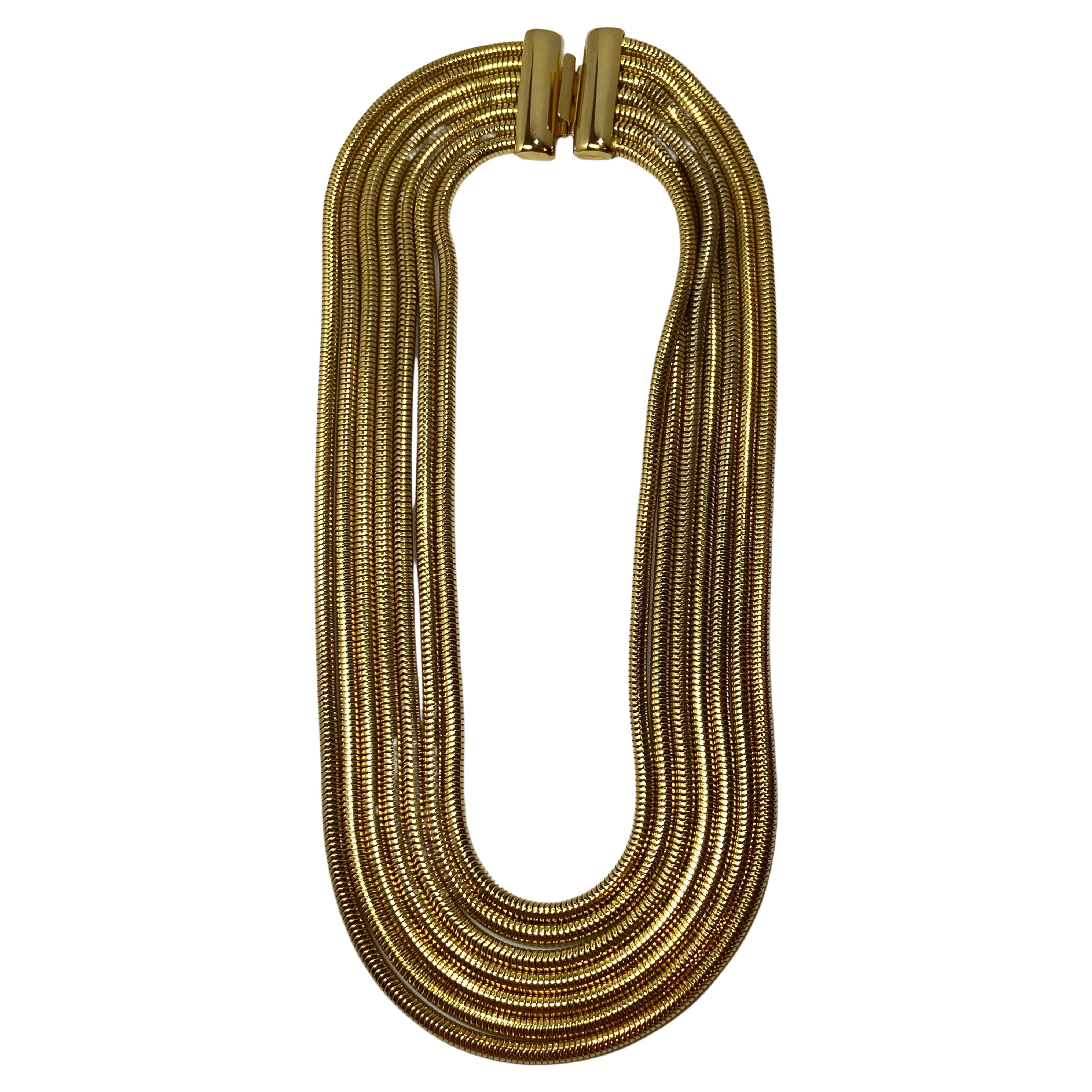 Mehrgliedrige glatte Schlangenglieder-Halskette mit polierten Goldbeschlägen im Angebot