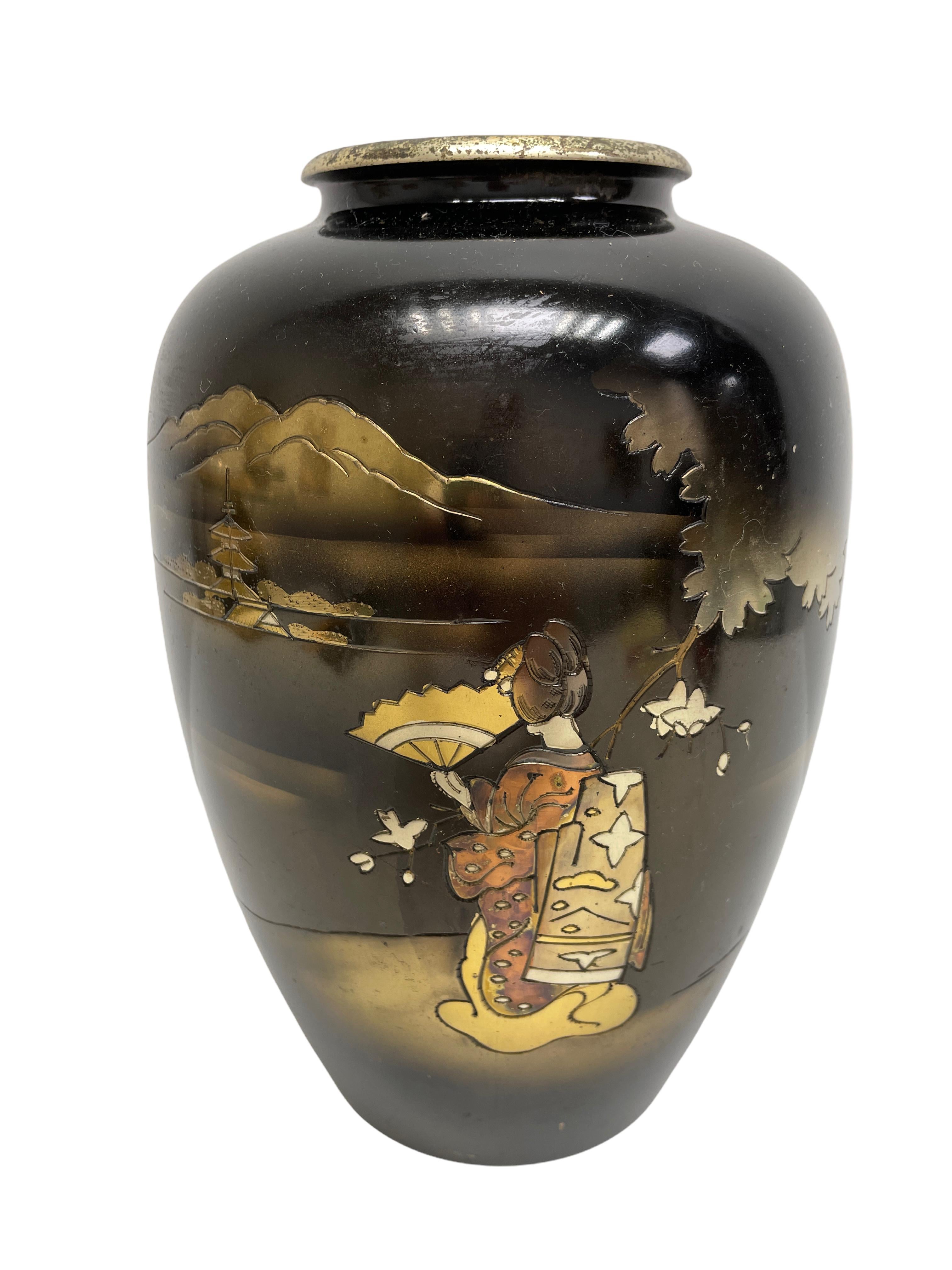 This exquisite vase has been madein Japan. It is signed by the Artist or manufactory. Made of Metal. A nice addition to any room.
  