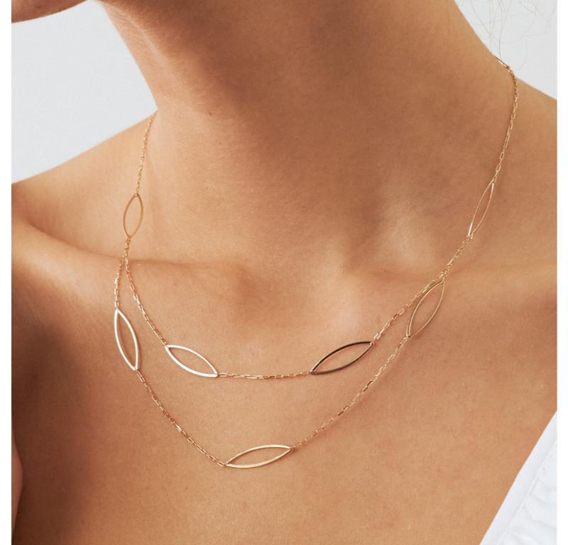 Introducing the 14K Solid Gold Multi Layer Necklace, a reflection of Orena Jewelry's unwavering commitment to superior artistry. Each necklace is masterfully handcrafted, displaying a luxury that's fused with timeless grace. It is an exemplary