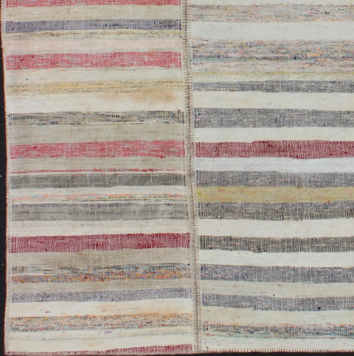 Multi-panel vintage Turkish Kilim rug with stripe design in gray, taupe, pink, red, turquoise, rug emd-11627, country of origin / type: Turkey / Kilim, circa mid-20th century.

This multi-paneled, square sized, striped Kilim is an example of
