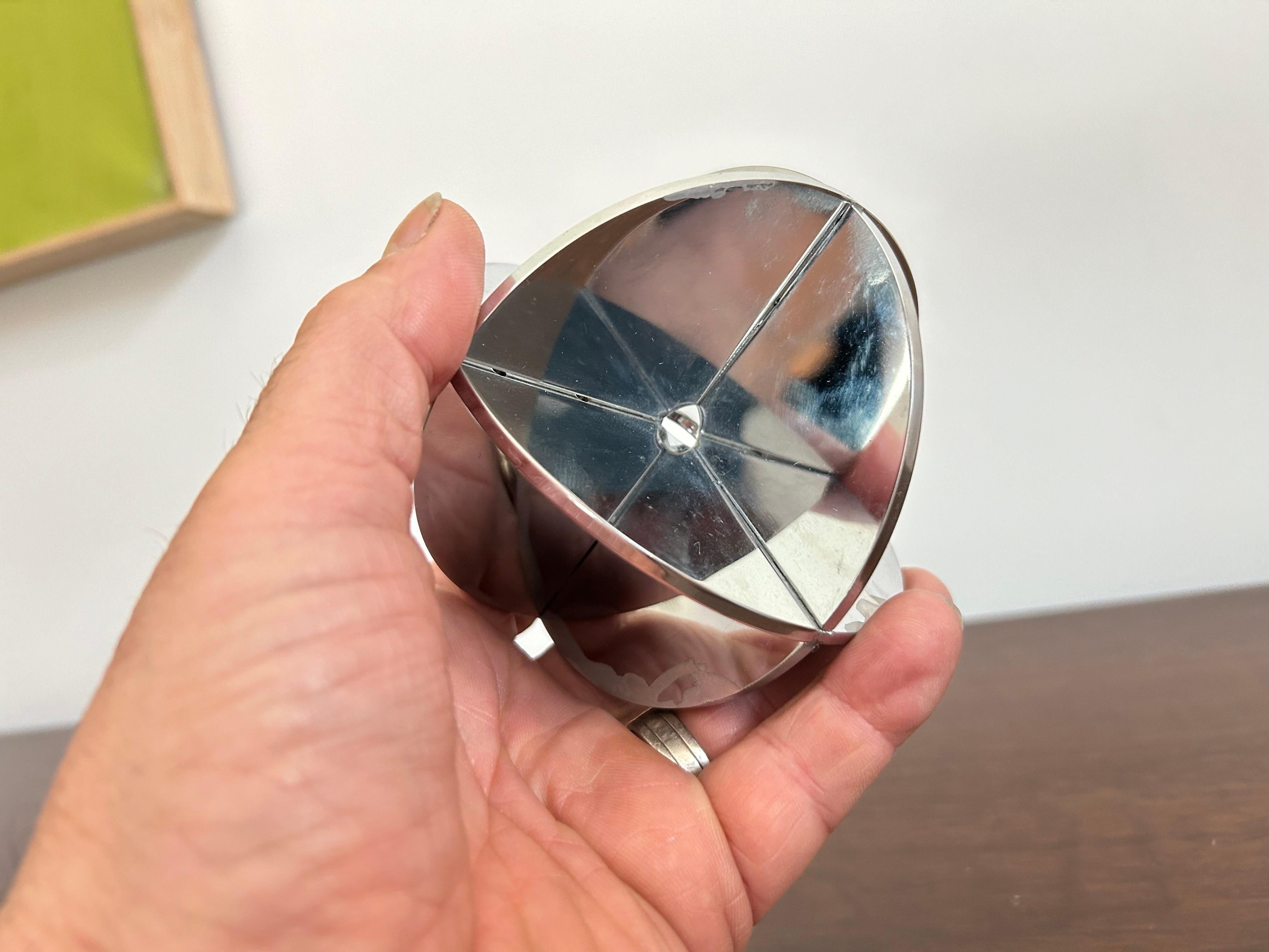 Nice modernist sculpture.  
Three chrome plated metal discs attached together creating an architectural sphere.. 
Great art object for a table-scape or display on a credenza… 