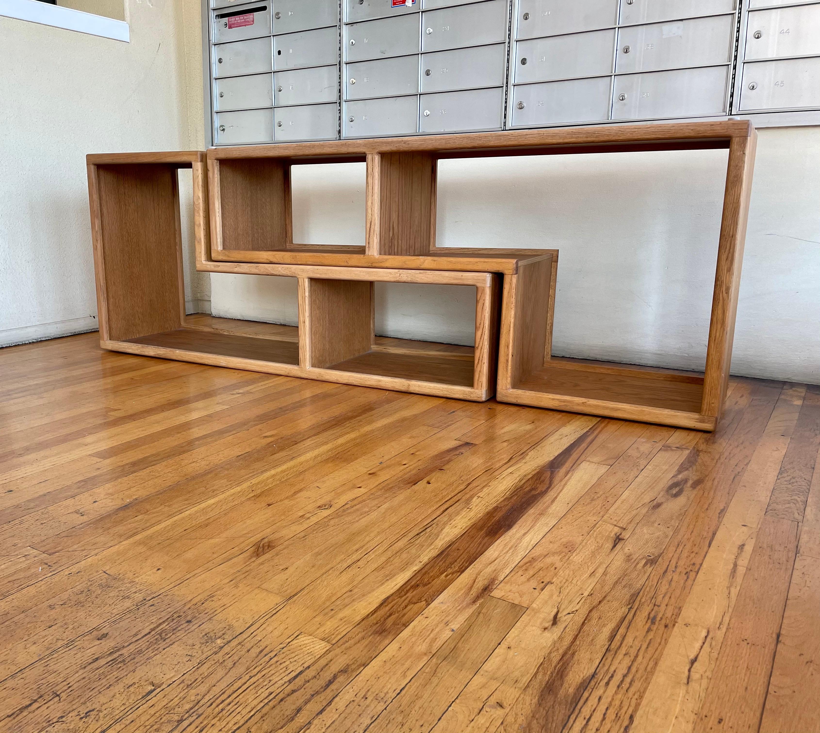 A very unique multi positions wall unit bookcase, these can go horizontal vertical or on top of each other, versatile and unique finish on both sides it can be used as a room divider. The measurements are per unit.