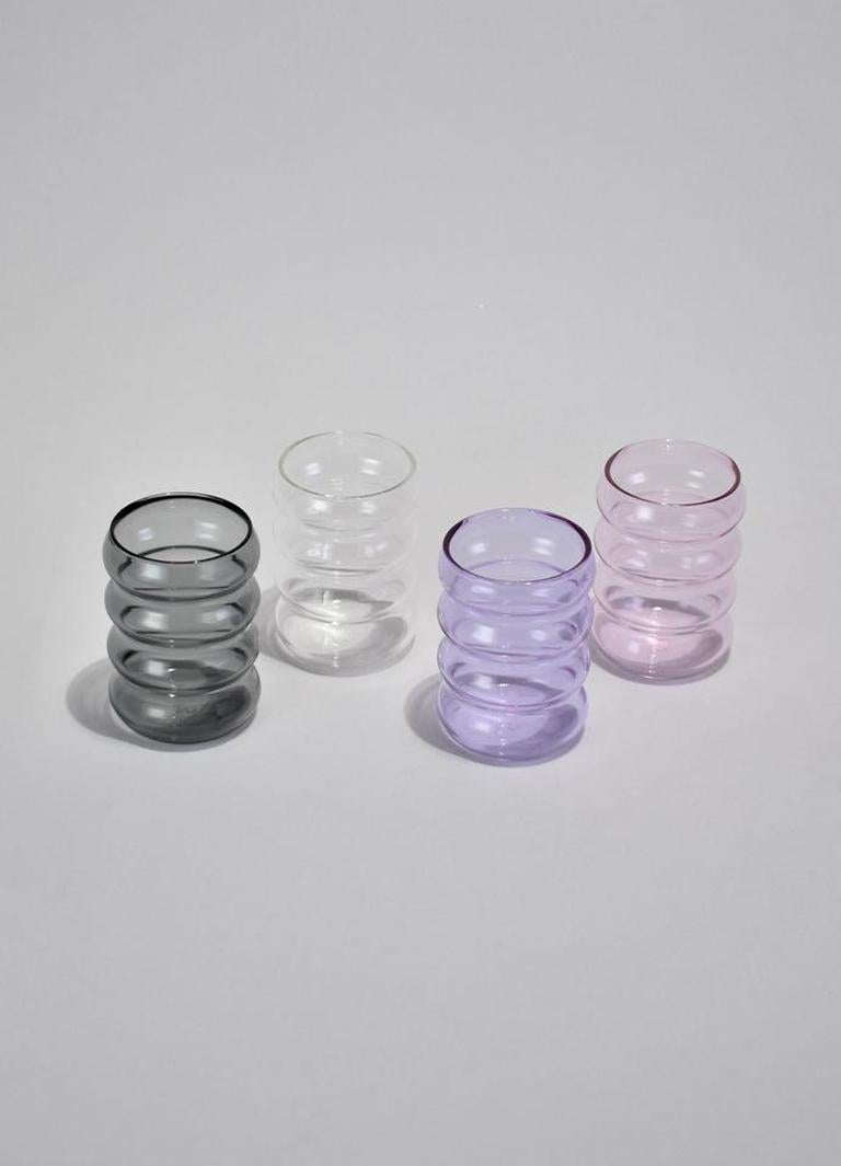 Wavy glass drinking cup set of four. Perfect size for water, wine, juice or spirits. Designed by Sophie Lou Jacobsen in New York.

Made of lightweight and durable borosilicate glass. Cups are heat and cold resistant, and dishwasher safe. Each holds