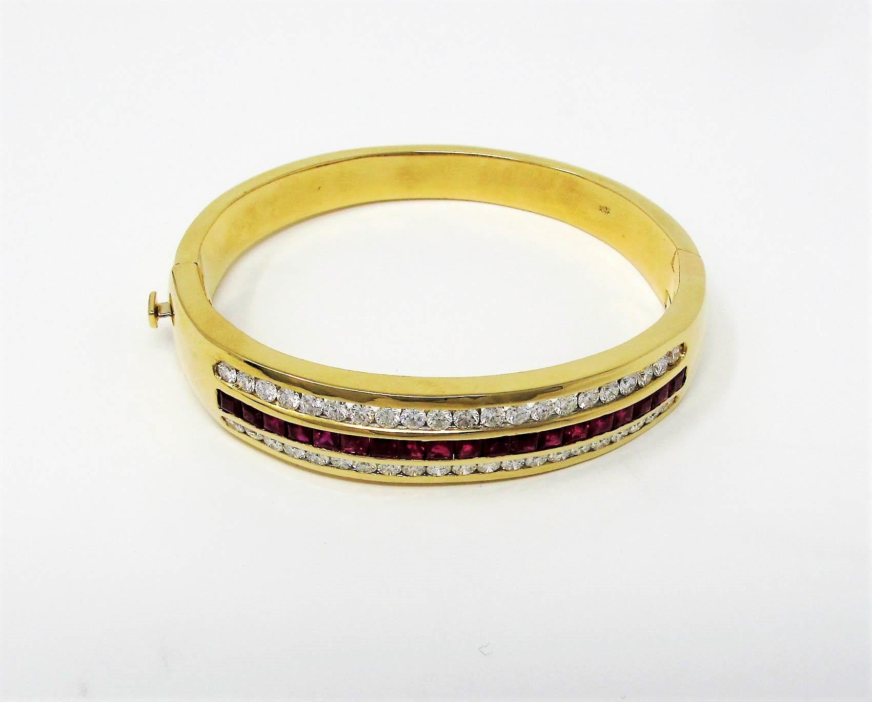 This classic bangle combines the sparkle of diamonds and the rich color of rubies in a substantial gold setting. It is smooth and comfortable to wear. 

This lovely bracelet features approximately 4.00 carats total of natural rubies, square modified