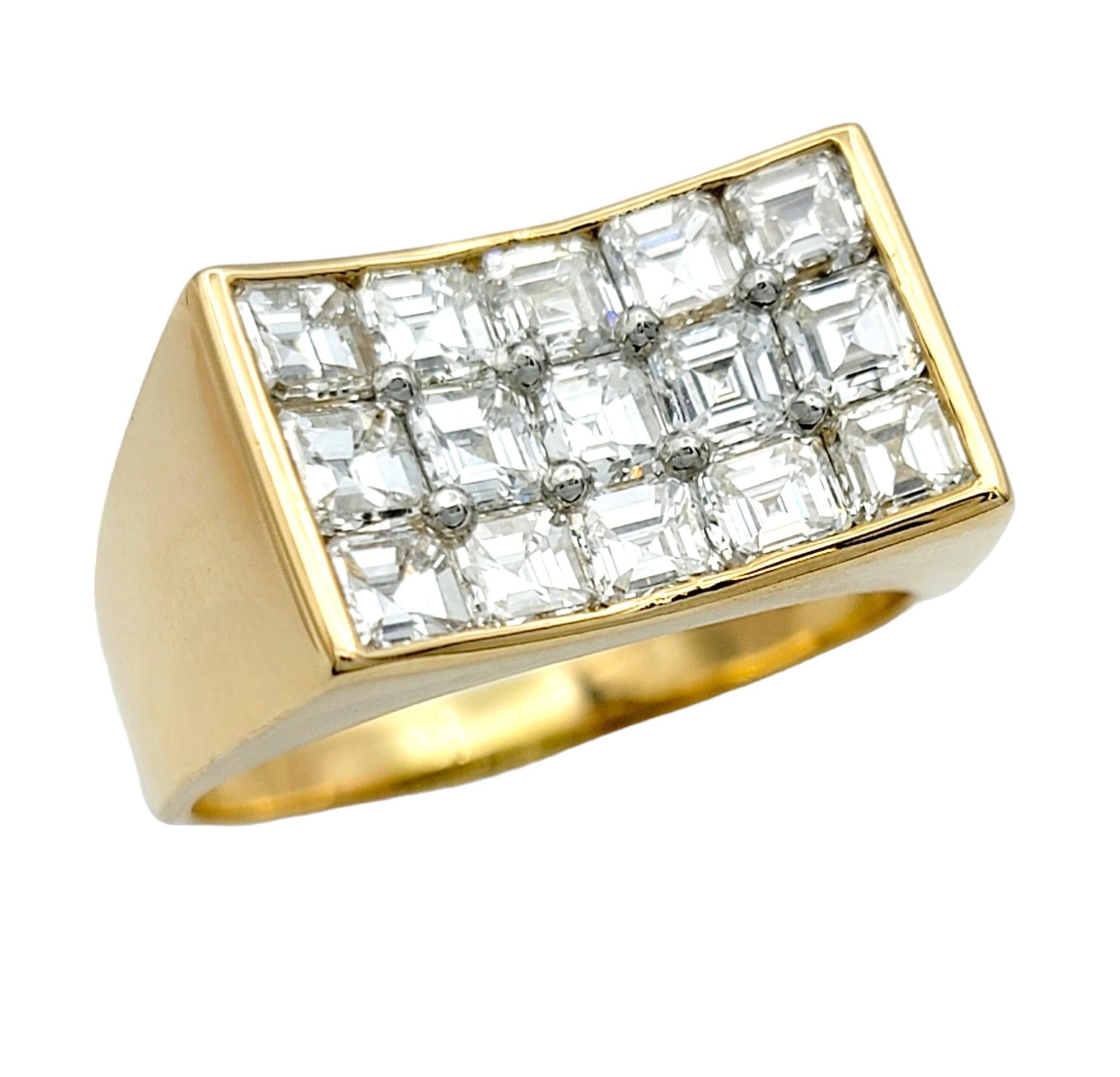 Ring Size: 8.75

This captivating ring, set in radiant 18 karat yellow gold, boasts a modern and distinctive design. At its heart, square diamonds are artfully clustered together, forming a mesmerizing concave shape that sets this piece apart. The