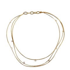 Collana contemporanea a più fili con diamanti in oro giallo 18 carati