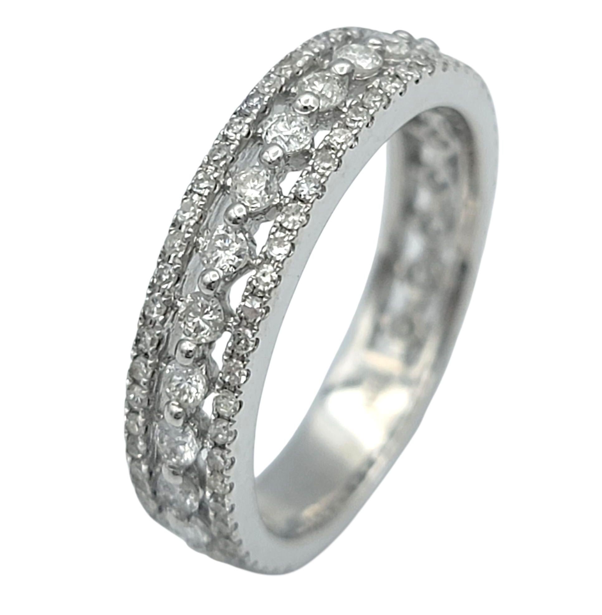Elegant and timeless, this diamond band radiates sophistication from every angle. Crafted in luminous 14 karat white gold, the band features two shimmering rows of sparkling diamonds, each precisely set to maximize brilliance. The alternating