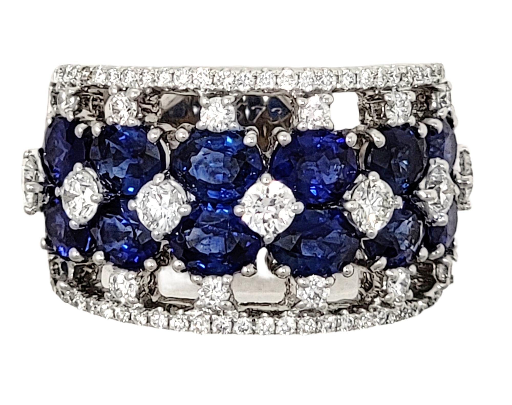 Ring size: 6.5

Stunningly sparkly sapphire and diamond band ring will fill your finger with undeniable beauty. This amazing piece is filled with dazzling white diamonds and sparkling blue sapphires set in several rows throughout the piece. The wide