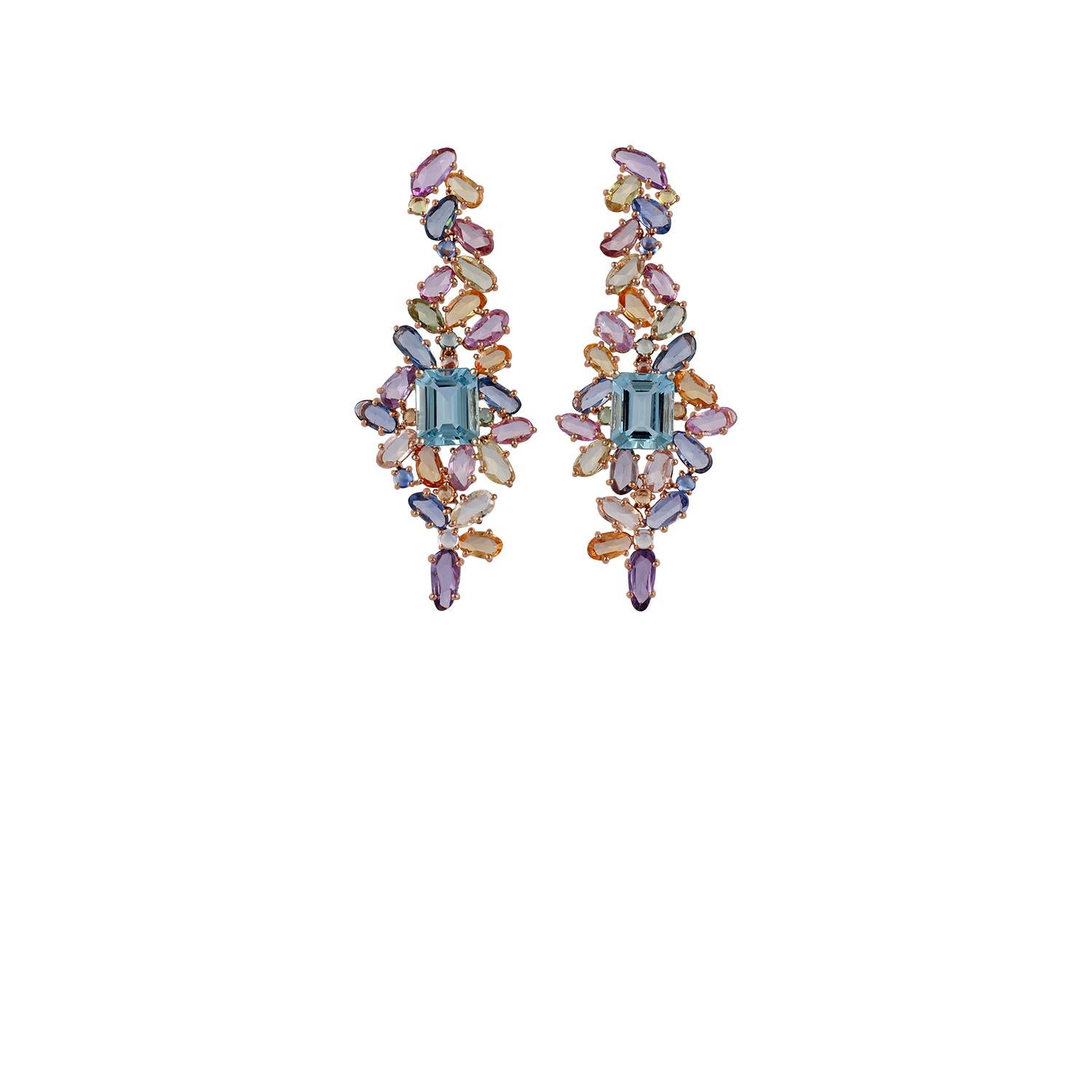 These are the designer earrings pair studded in 18K rose gold, features 46 pieces of rose cuts multi colour sapphire weight 19.46 carats, 18 pieces of round shaped cabochon multi colour sapphire weight 2.26 carats & 2 pieces of octagon-shaped fine