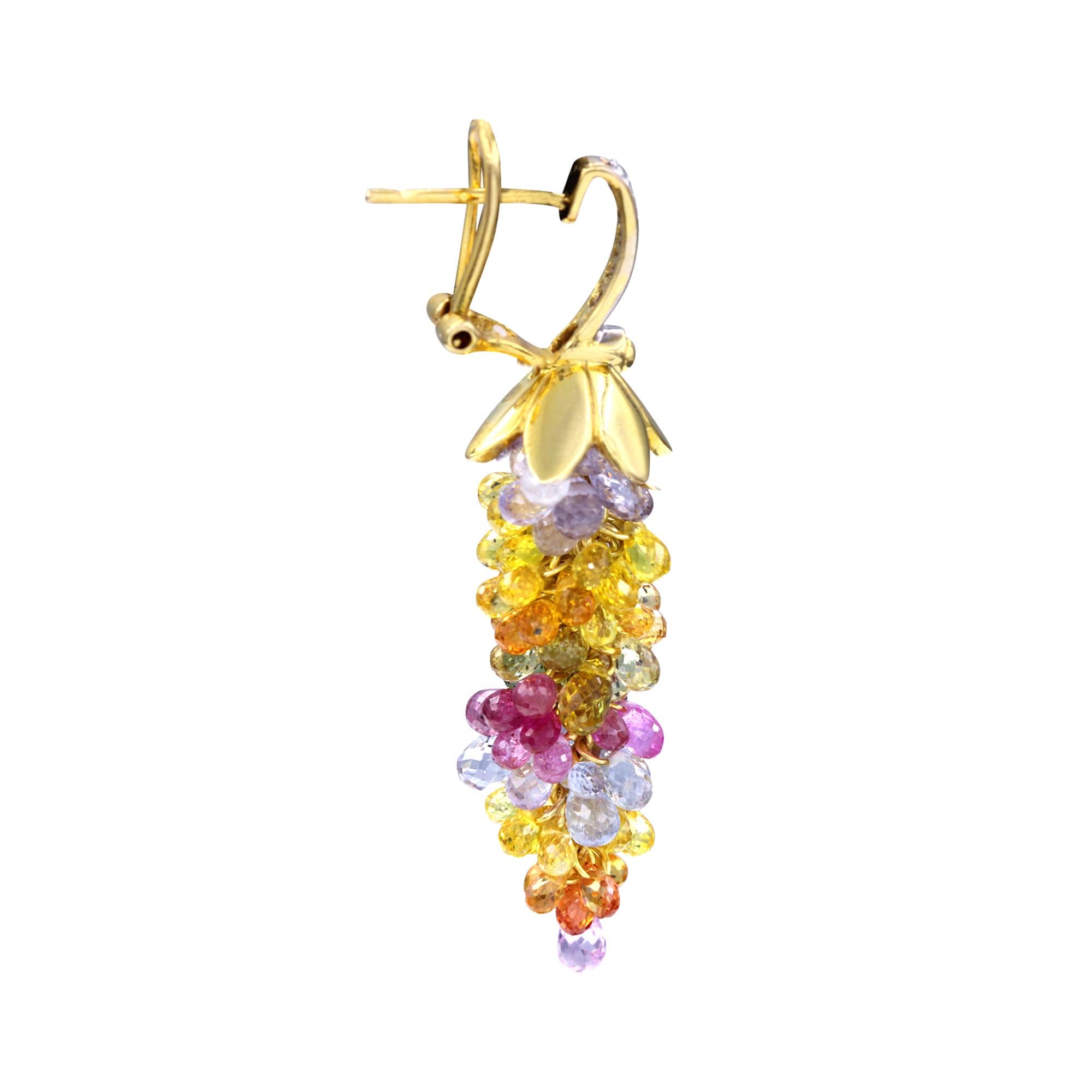 A beautiful pair of multi-colored chandelier earrings with white, yellow, blue, pink, and orange sapphires held together by a golden flower cap, accented with diamonds on the top in 18K White Gold. Mounted in 18K Yellow Gold. 