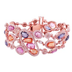 Bracelet jonc en or 18 carats avec plusieurs saphirs et diamants