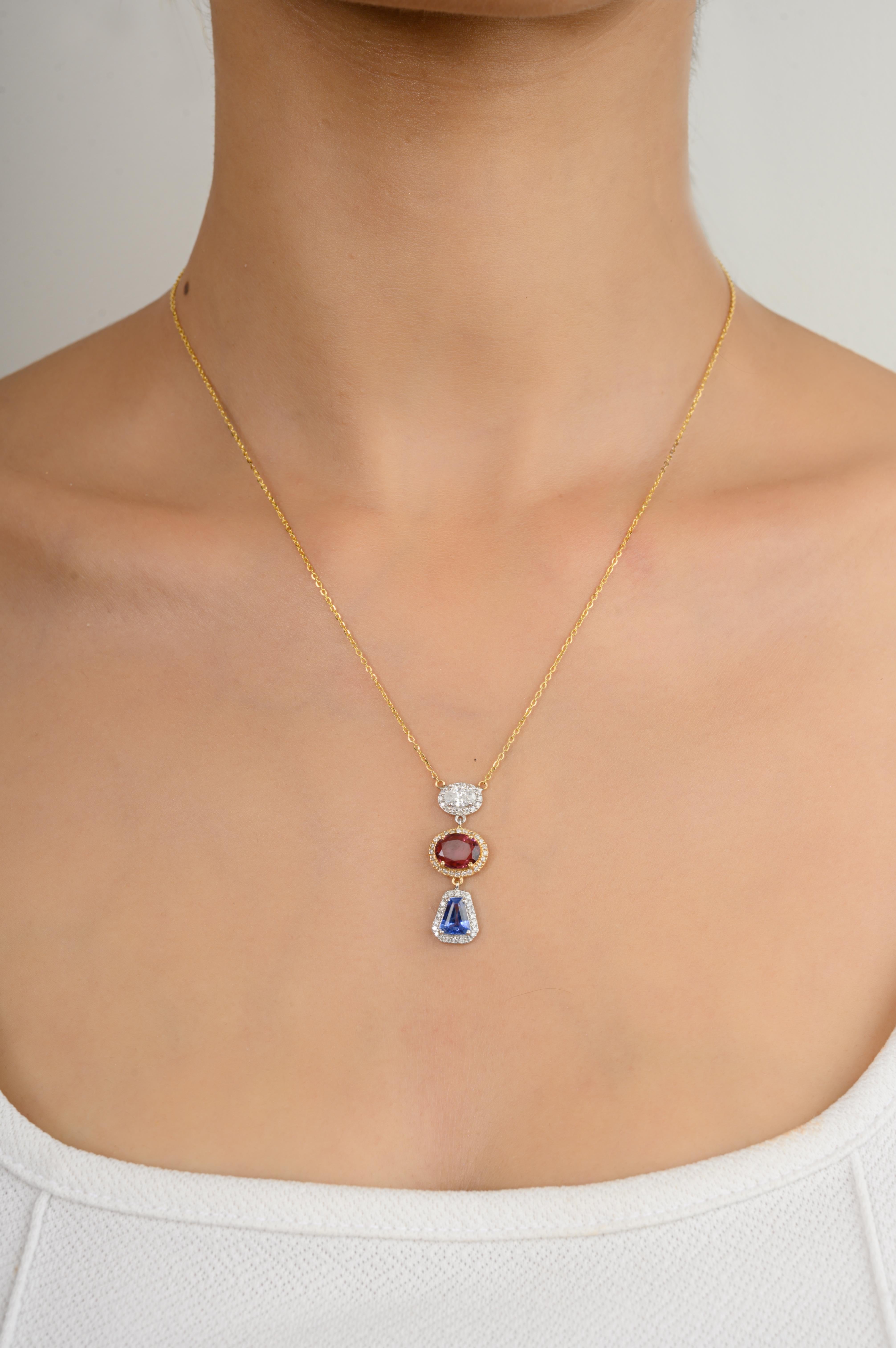 Multi Sapphire Diamond Halo Long Pendant Chain Necklace in 18K Gold studded with mixed cut pink sapphire and blue sapphire of 2.1 carats. This stunning piece of jewelry instantly elevates a casual look or dressy outfit. 
Sapphire stimulates