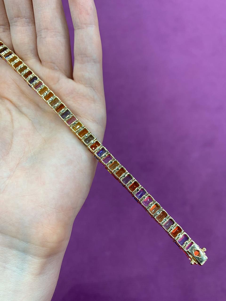 Bracelet Gold 14 K
Orange Sapphire 14-11,2
Green Sapphire 14-11,2
Pink Sapphire 7-5,6 2/2A
Red Sapphire 7-5,6 2/2A
Blue Sapphire 5,6 (2)/2
Weight 19,89 grams

With a heritage of ancient fine Swiss jewelry traditions, NATKINA is a Geneva based