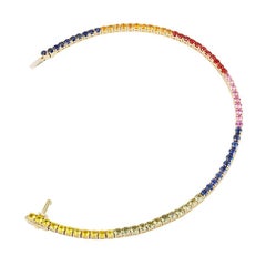 Bracelet tennis coloré en or jaune avec plusieurs saphirs et diamants, bijouterie d'art