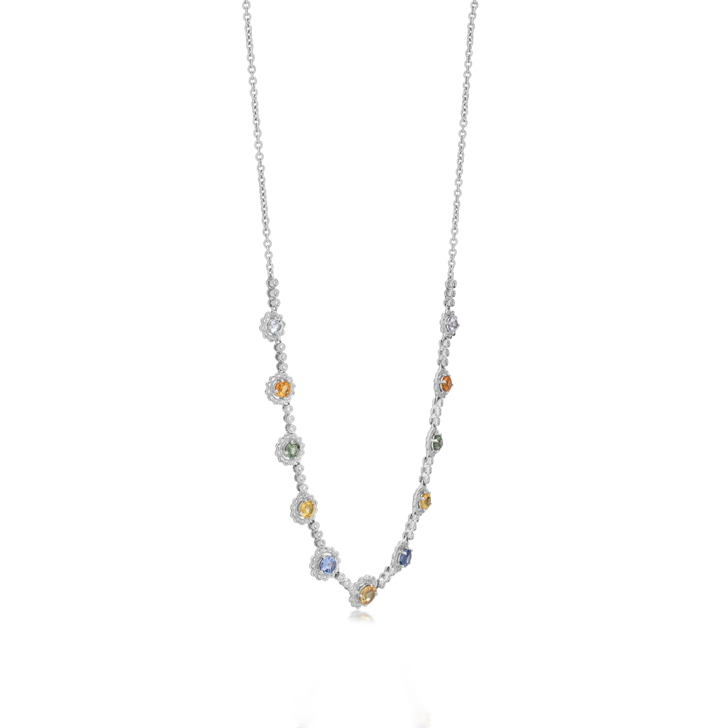 This Gemistry necklace Adds some color into the mix with this eye-catching strand of multi-sapphire totaling 5.5 carats. This station necklace presents multi-sapphire rounds in diamond halos along an 18k white cable chain. Lobster clasp,