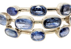 Pulsera brazalete multitonos de zafiro azul y tanzanita en oro blanco de 14 quilates