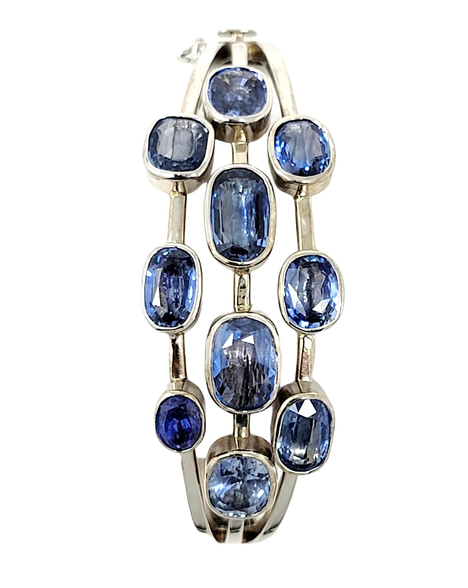 Contemporary Multi Shades of Blue Sapphire and Tanzanite 14 Karat White Gold Bangle Bracelet  For Sale