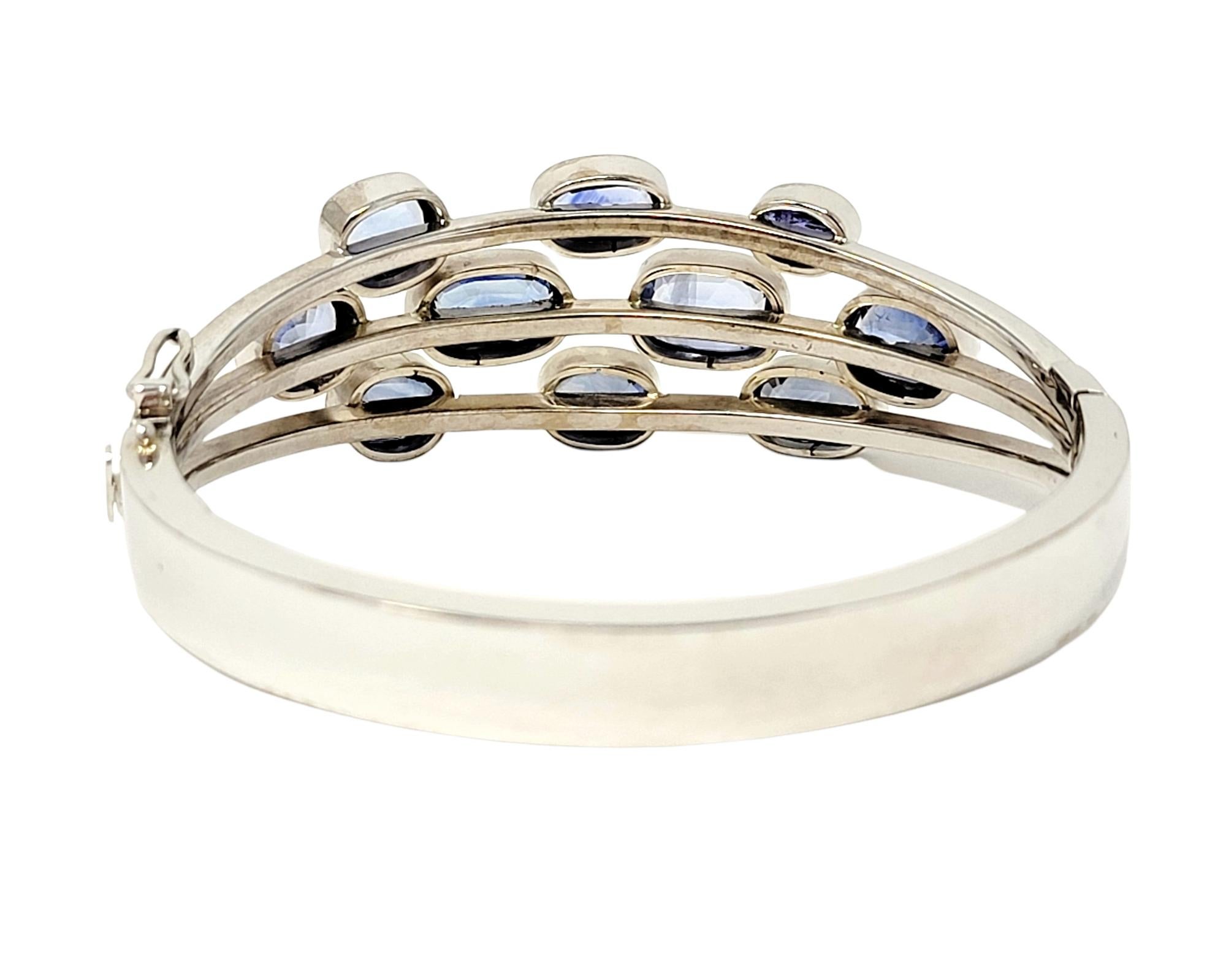 Oval Cut Multi Shades of Blue Sapphire and Tanzanite 14 Karat White Gold Bangle Bracelet  For Sale