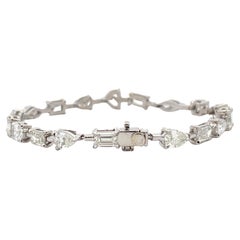 Bracciale da tennis con diamanti a forma multipla certificati IGI 9,73 carati G-H VS-SI in oro 18K