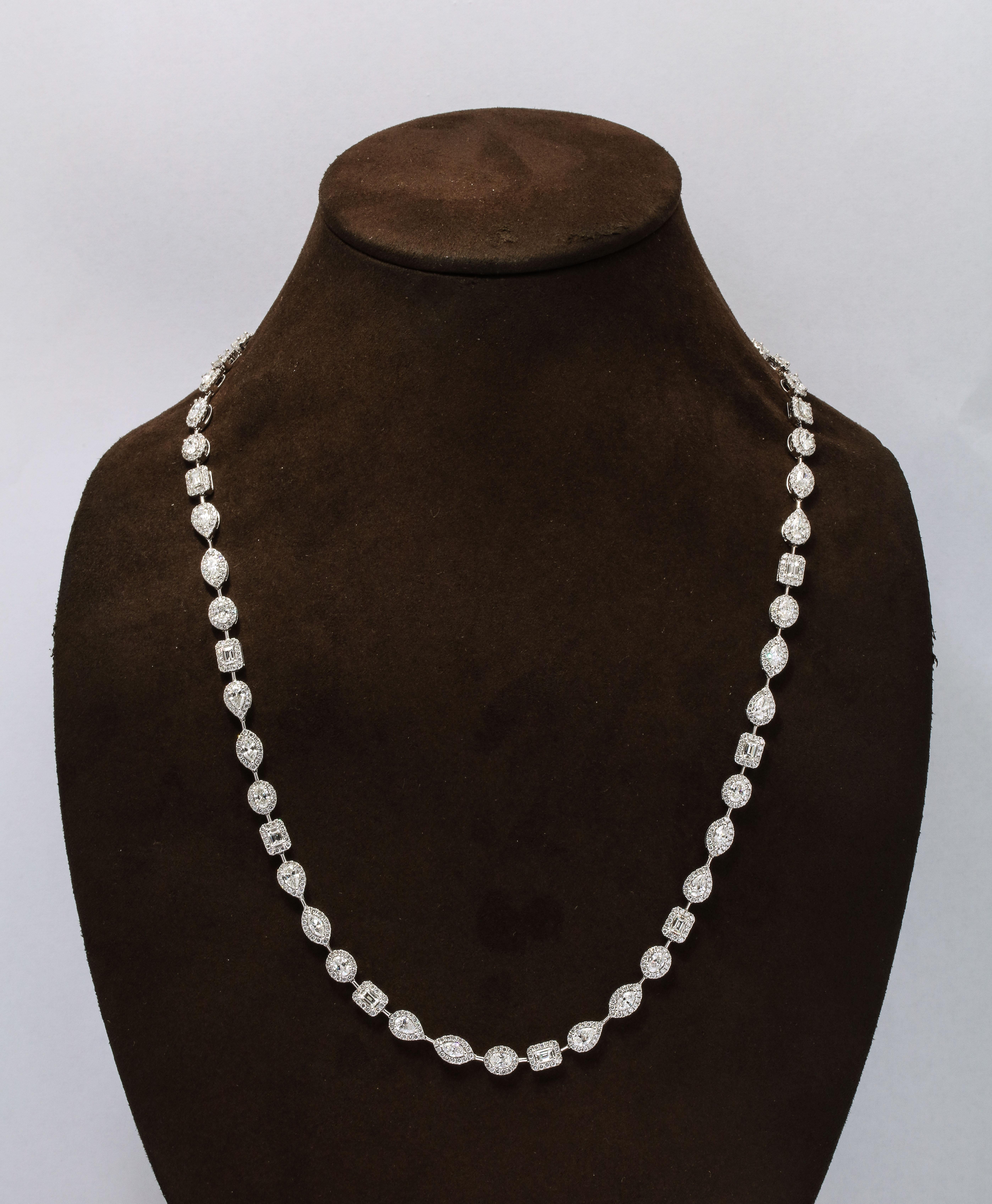 
An INCREDIBLE piece!!  Wearable at 3 different lengths!!

A total of 29.23 carats of white Pear, Emerald, Oval, and Marquise cut diamonds surrounded by round brilliant cut diamonds. 

Custom made with multiple locks, this necklace can be worn alone
