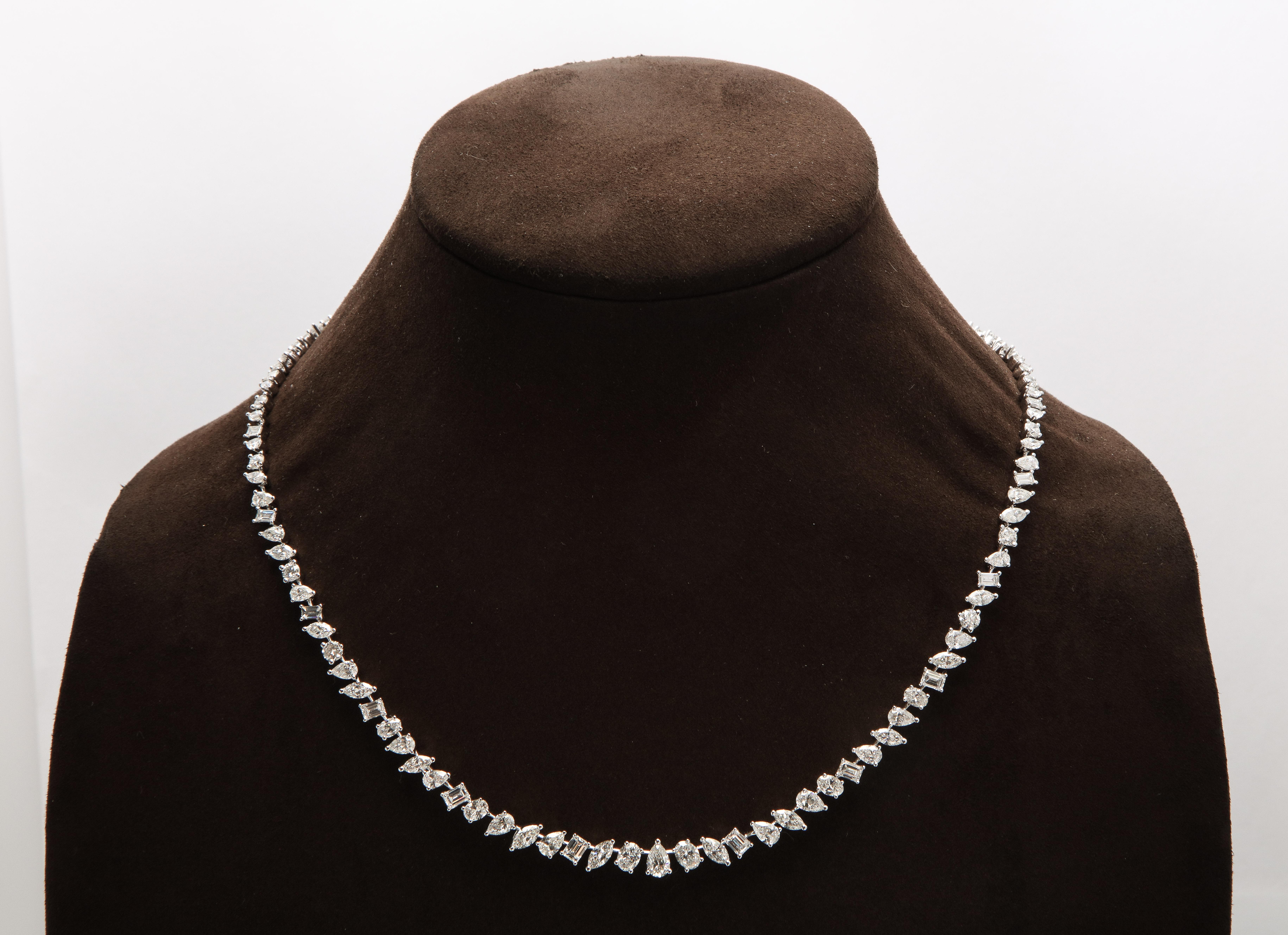 
A unique diamond necklace.

17.20 carats of oval, pear, emerald, marquise and round cut white diamonds set in 18k white gold. 

16 inch length with a removable piece to wear at 15 inches. 

This necklace can be dressed up or down, perfect for a