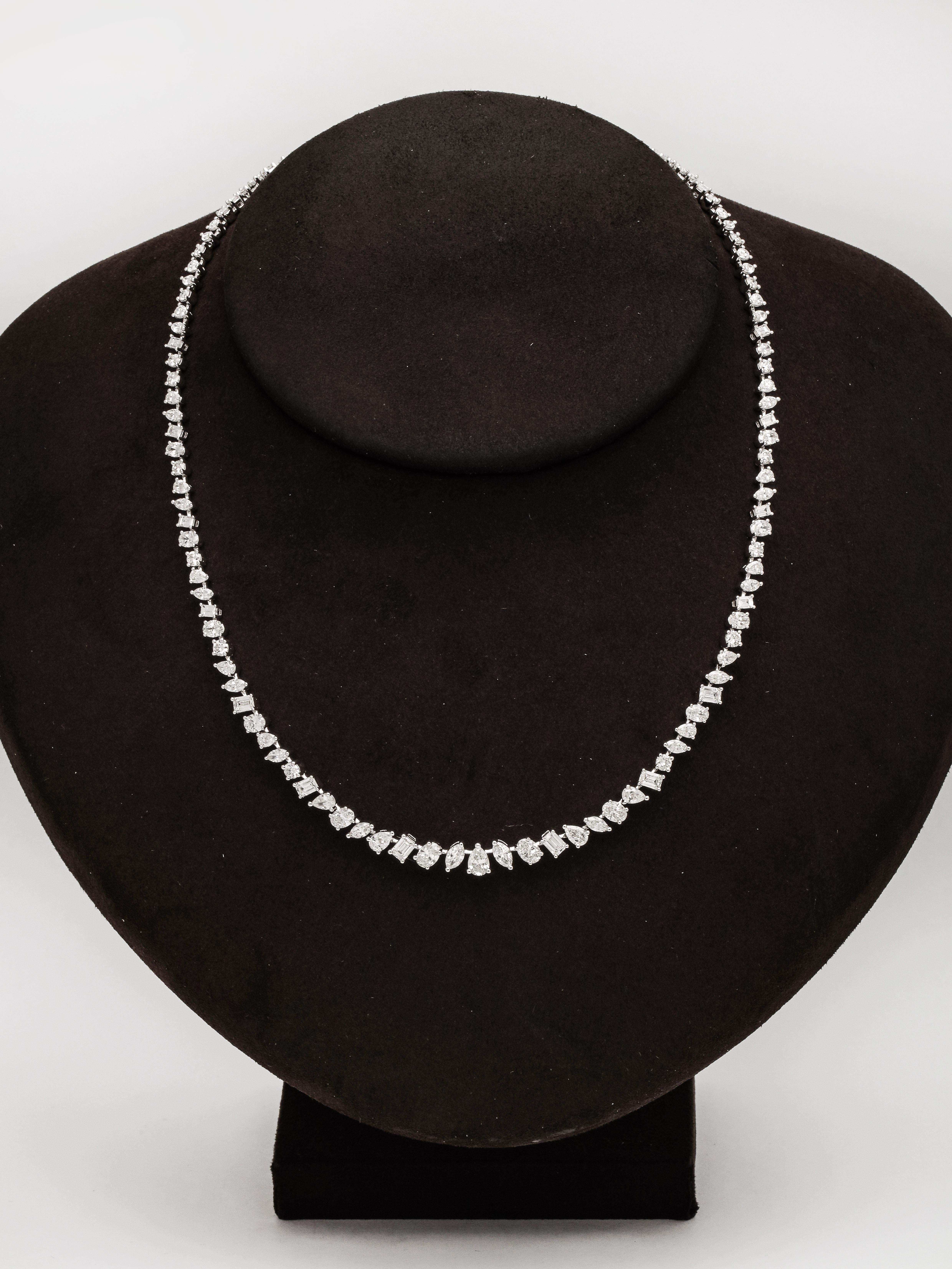 
A unique diamond necklace.

12.01 carats of oval, pear, emerald, marquise and round cut white diamonds set in 18k white gold. 

16 inch length 

This necklace can be dressed up or down, perfect for a black tie event or fabulous with a t shirt!

We