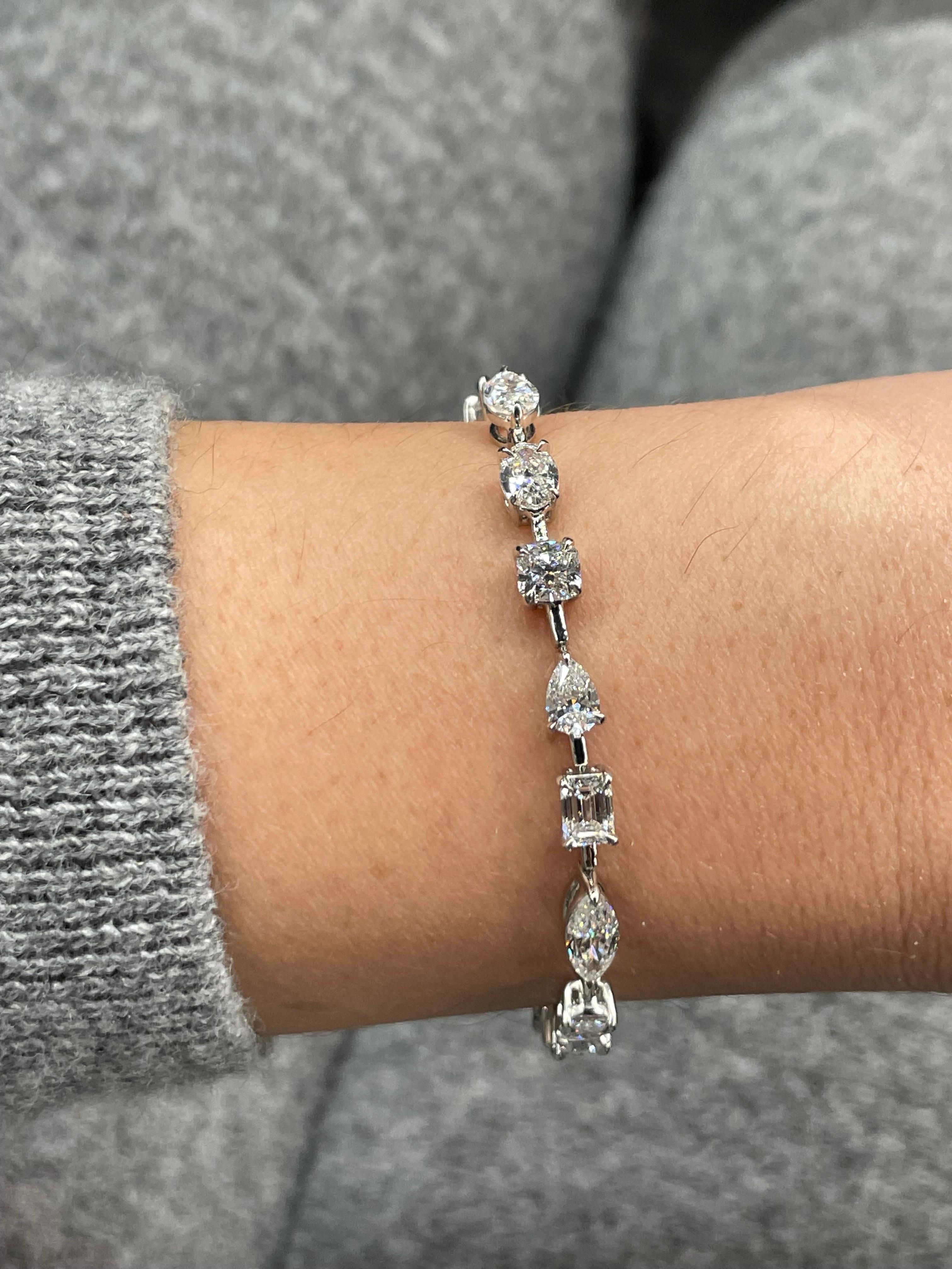 Multi-shape diamond tennis bracelet featuring 19 diamonds weighing 9.63 carats crafted in Platinum.
Order:
Half Moon, Pear, Cushion, Marquise, Emerald, Pear, Oval, Princess, Pear, Radiant, Marquise, Emerald, Pear, Cushion, Oval, Marquise, Pear,