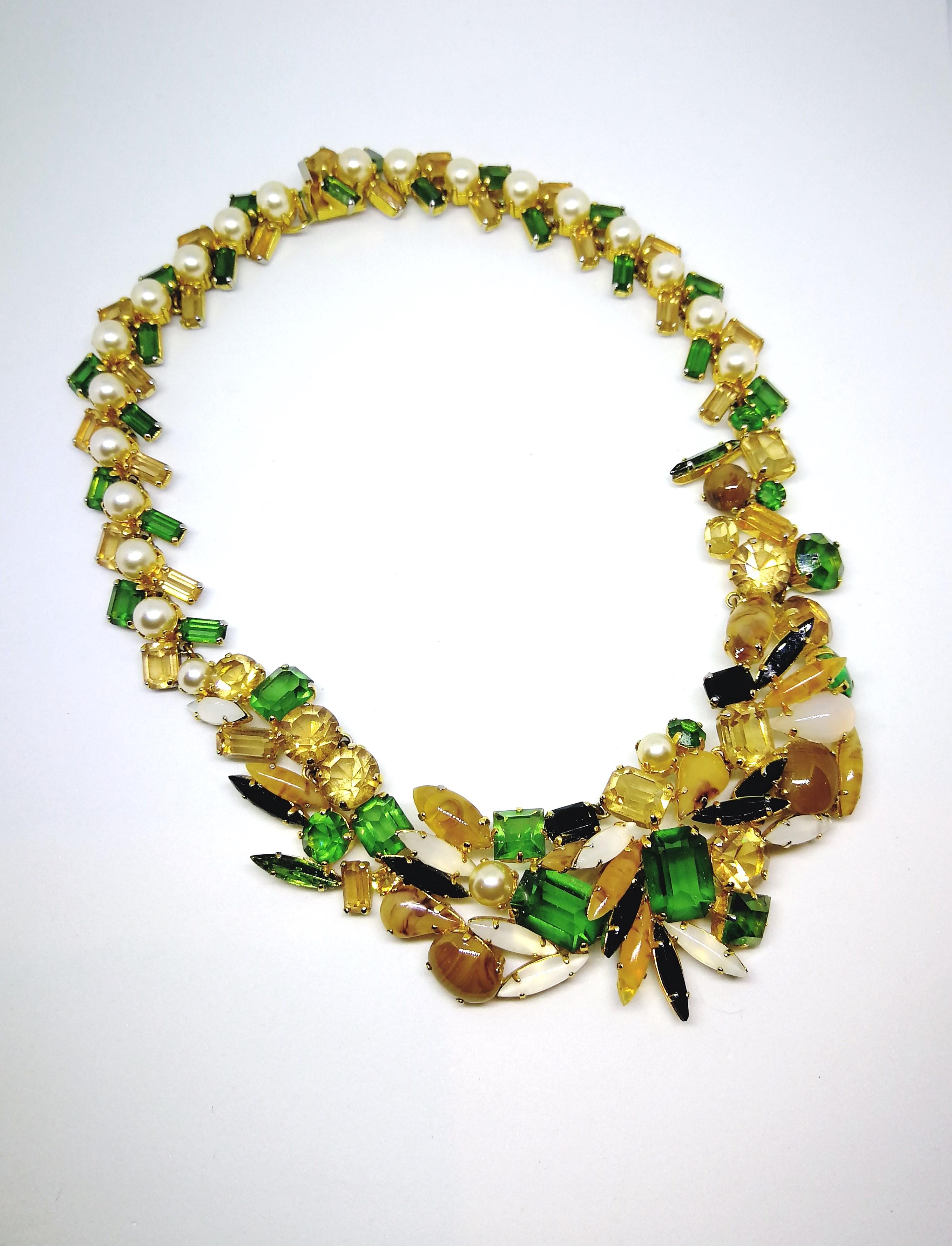 A rare and highly collectable necklace from 1962, made by Henkel and Grosse for Christian Dior. Composed of unique assorted shaped, opaque and clear pastes, set in a haphazard, organic design, interspersed with glass pearls, at the front, it then