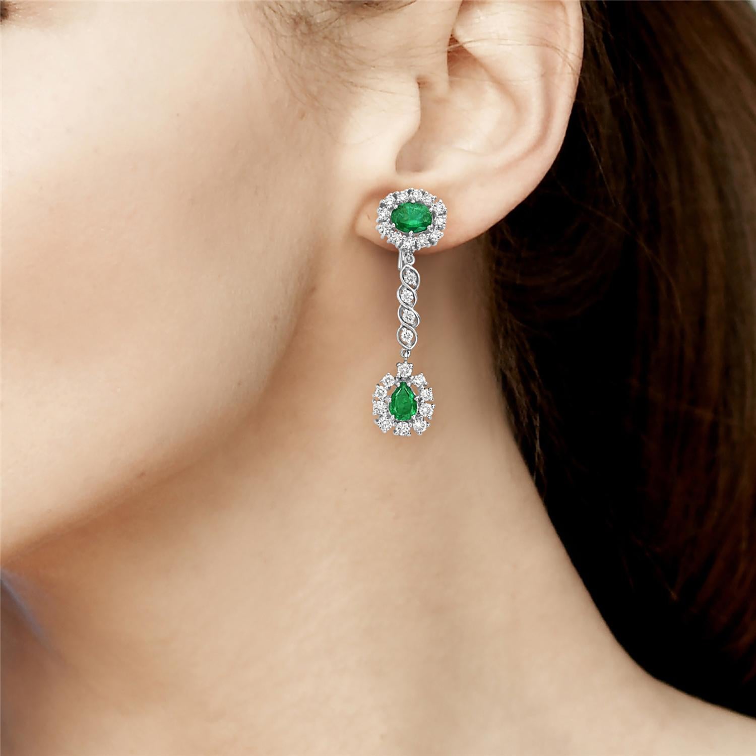 The earrings are designed with a pear and round shaped emerald that provides a unique look and adds a pop of color. Made from 18k white gold, these earrings feature brilliant cut diamonds that adds just the right amount of sparkle. 

18KT:14.43g;