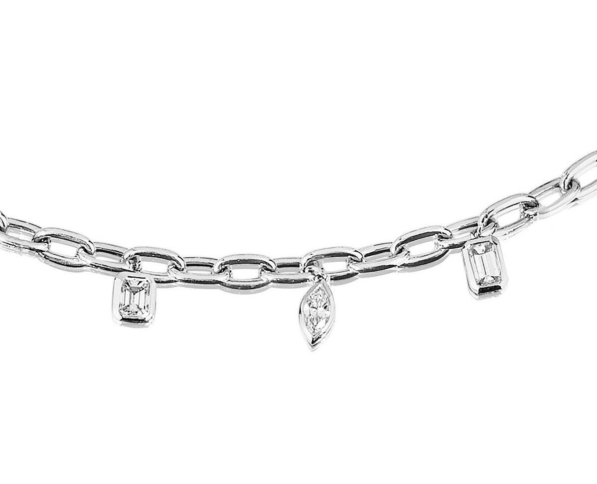 Solid Link bracelet set with 7 Multi Shaped White Diamonds in Bezel Set Charm Style.
Great for Stacking with a watch a bangle/bracelet or with multiple of these Bracelets as shown.
1.64 Carats.
18 Karat White Gold.
Lobster Claw Lock.
Measure 6.75