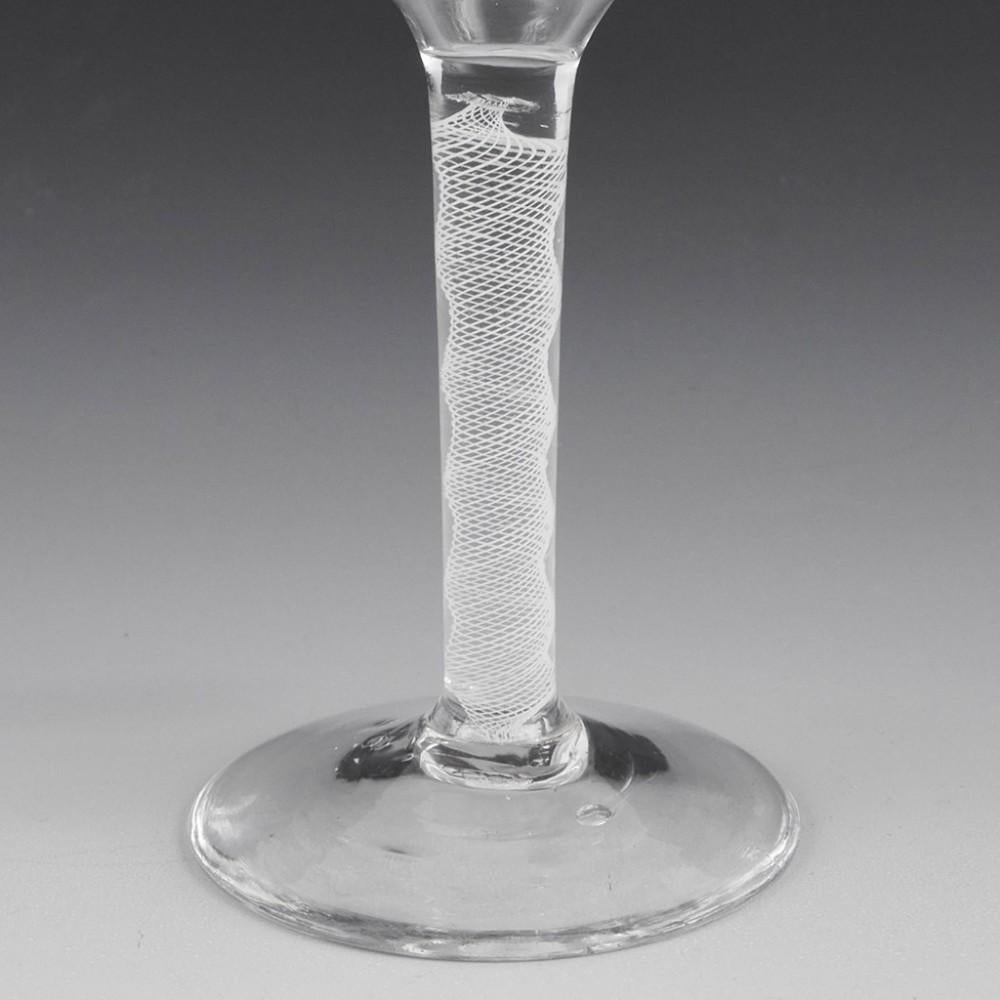 Heading : Multi Spiral Opaque Twist Wine Glass
Period : George II- George III
Origin : England
Colour : Clear
Bowl : Ogee
Stem : Multi spiral opaque
Foot : Conical
Pontil : Snapped
Glass Type : Lead
Size :  Height 14.8cm, bowl 5.0 , foot
