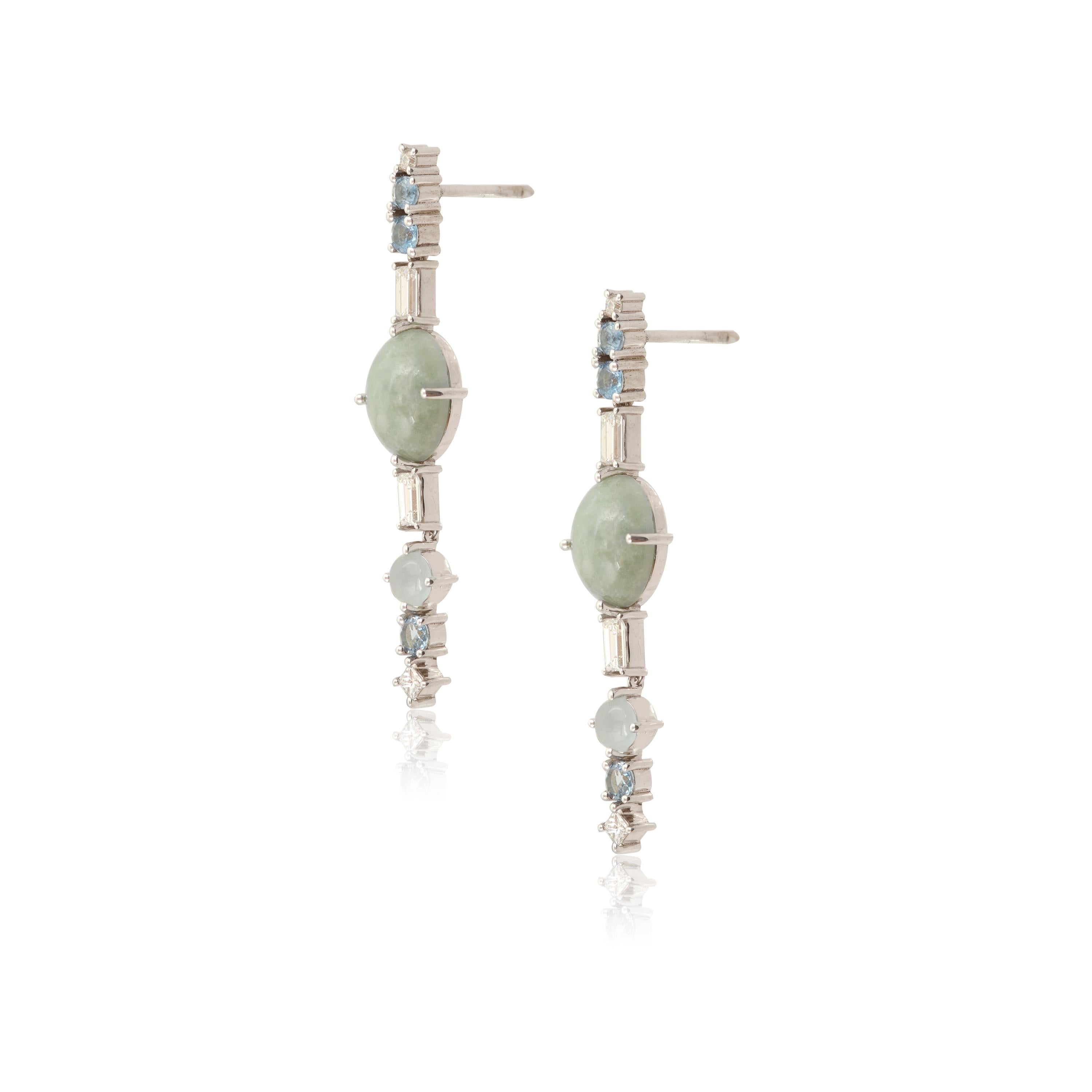 Designer: Alexia Gryllaki
Dimensions: L43x9mm
Weight: approximately 5.6g (pair) 
Barcode: OFS007

Multi-stone long earrings in 18 karat white gold with oval cabochon jadeites approx. 5.50cts, round faceted aquamarines approx. 1.82cts, round