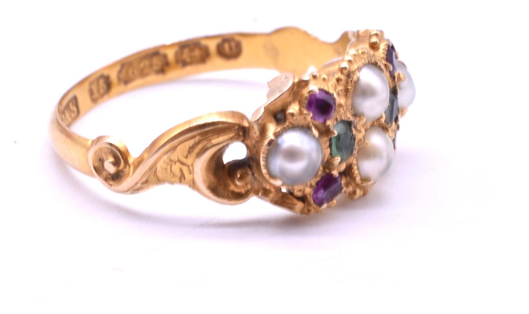 Lovely multi-stone 15K ring with 4 natural pearls as the central stones and 4 rubies and 2 emeralds accenting the pearls. This ring could have been worn as part of the Suffragist movement, as the white, violet, and green stones convey the message
