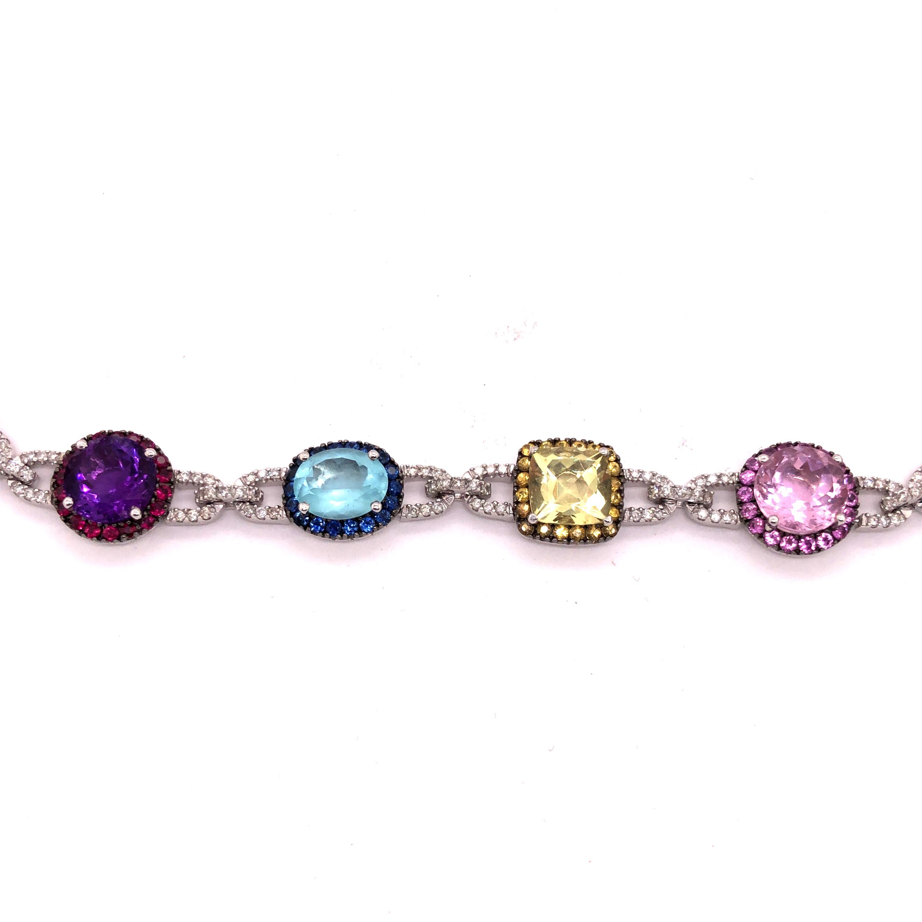 Designed as alternating multi-colored gemstones set within a gemstone frame join by diamond set links and suspending a detachable drop

Metal: 14k white and white gold

Diamonds:  approximate total weight of 2.62 carats
Stones: amethysts, citrines, 