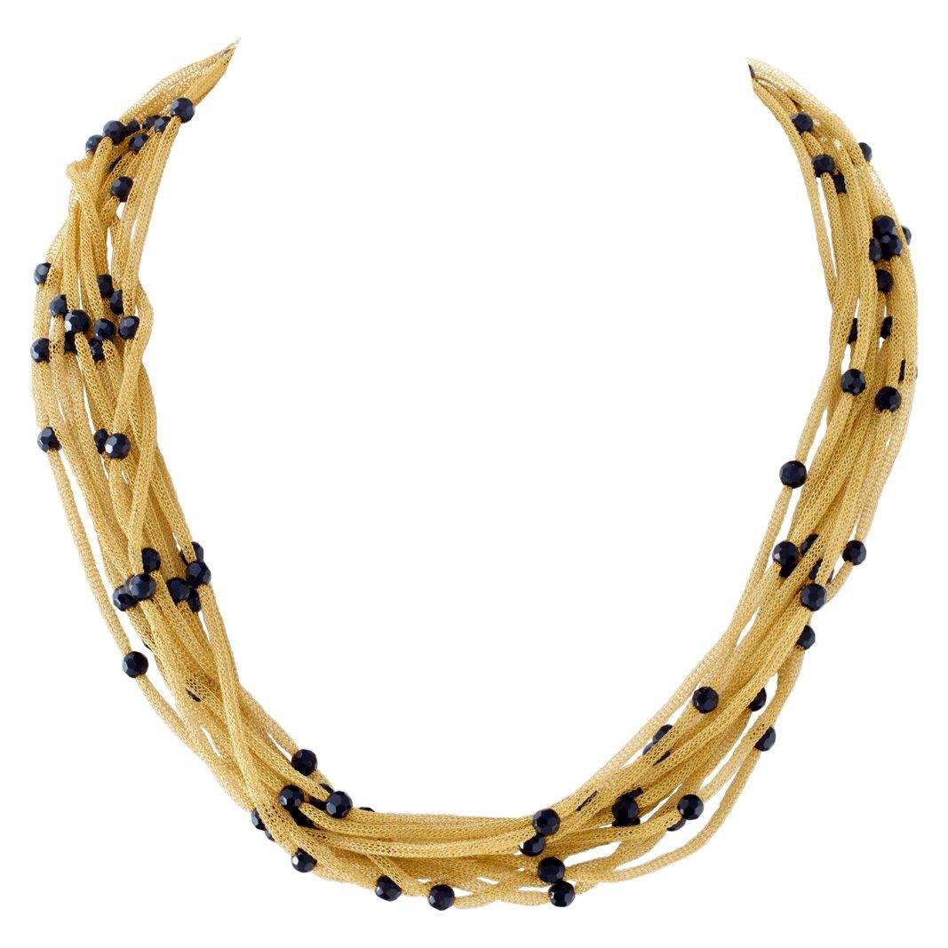 Beautiful multi-strand 18k gold necklace with faceted onyx bead stations. Length is 18