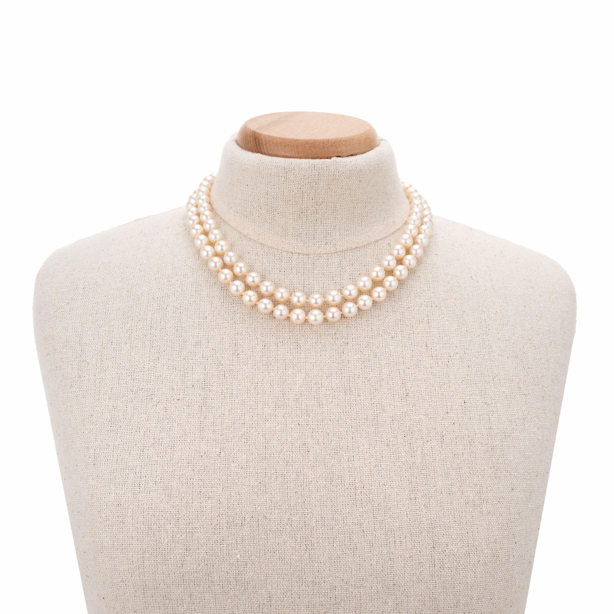 Japanese cultured pearl necklace with two strands that nestle just right on the neck with one at 16 and the other at 18 inches. 14k gold custom clasp. 

90 natural white with pink overtone Akoya pearls, 8mm, excellent lustre, few blemishes, Mikimoto
