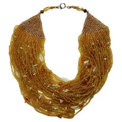 Multi Strand Amber Glass Bead Necklace with Bead Decoration