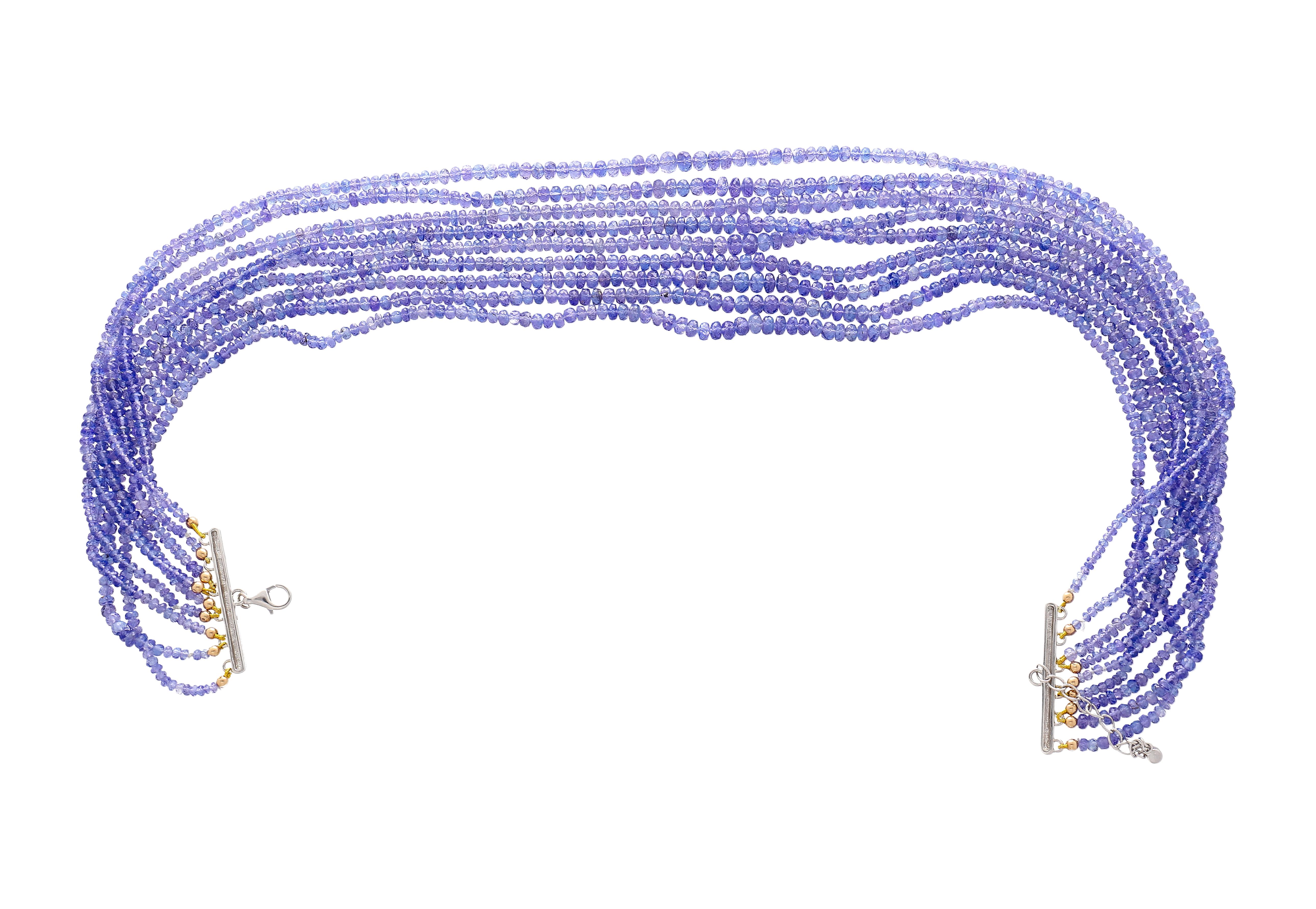 18K White Gold Tanzanite Bead & Diamond Multi Strand Necklace.

This beautiful necklace measuring 17.5 inches, features an array of 1713 pieces of blue tanzanite beads with a Carat weight of 560 total, strung across the multiple strands. The